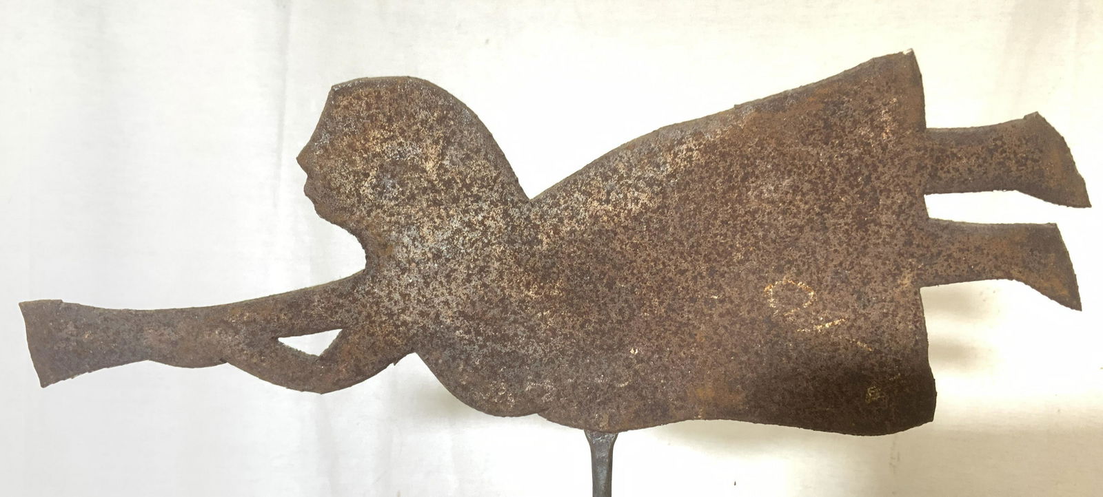 Antique Metal & Wood Folk Art, HAITI: Metal and wood folk art decor. Base is wood, figure is metal, possibly iron. Depicts a figure flying, wield what appears to be a trumpet. Label on back reads as FOREIGN ACCENTS HANDCRAFTED AND IMPORTE