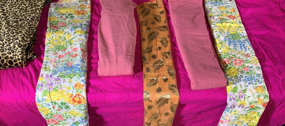 Group Lot 9 Party Tablecloths: Velour plush ANIMAL PRINT OBLONG tablecloth with stretch, 130 in. L x 76 in. W. Oversized hot pink round tablecloth, estimate 88 in. diameter, possibly silk. Oversized rectangular red velour tableclot