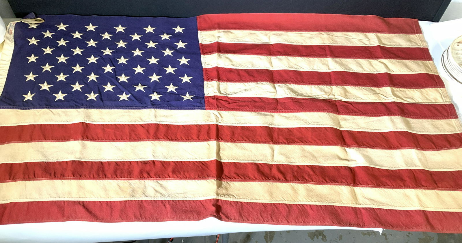 Vintage ANNIN 50 Star AMERICAN FLAG, Cotton: Flag pole AMERICAN FLAG, a collectible, top and bottom grommets on left side, labeled DEFIANCE 100% Cotton ANNIN & Co Bunting Verona, NJ ( with Eagle head logo- since 1847). Machine embroidered stars,