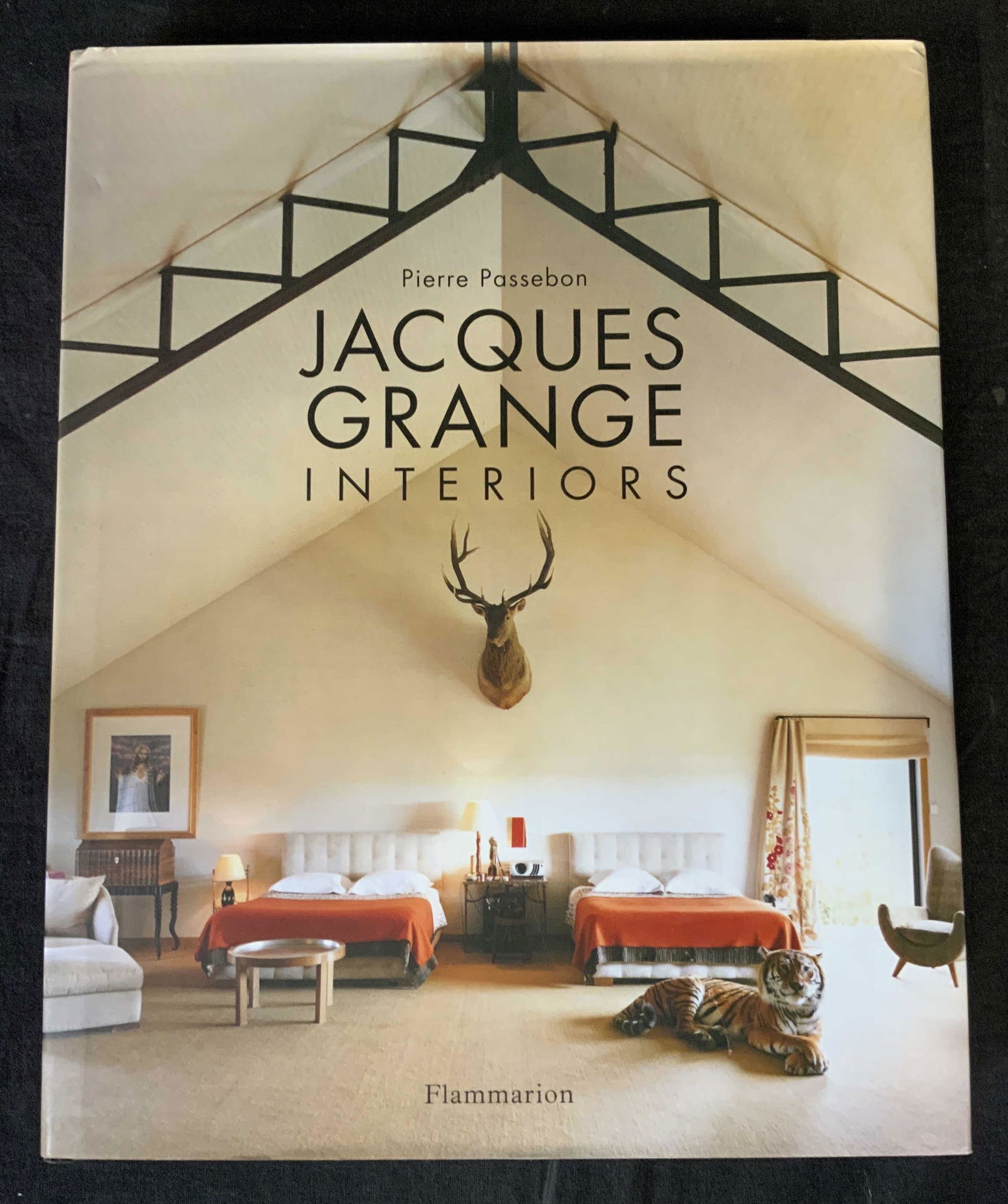 Jacques Grange Interiors Coffee Table Book: Jacques Grange Interiors Coffee Table Book, inscription to cover reads ‘Pierre Passebon Jacques Grange Interiors Flammarion’, measures 12 1/2 x 10 inches, some folding to boom jacket but overall i