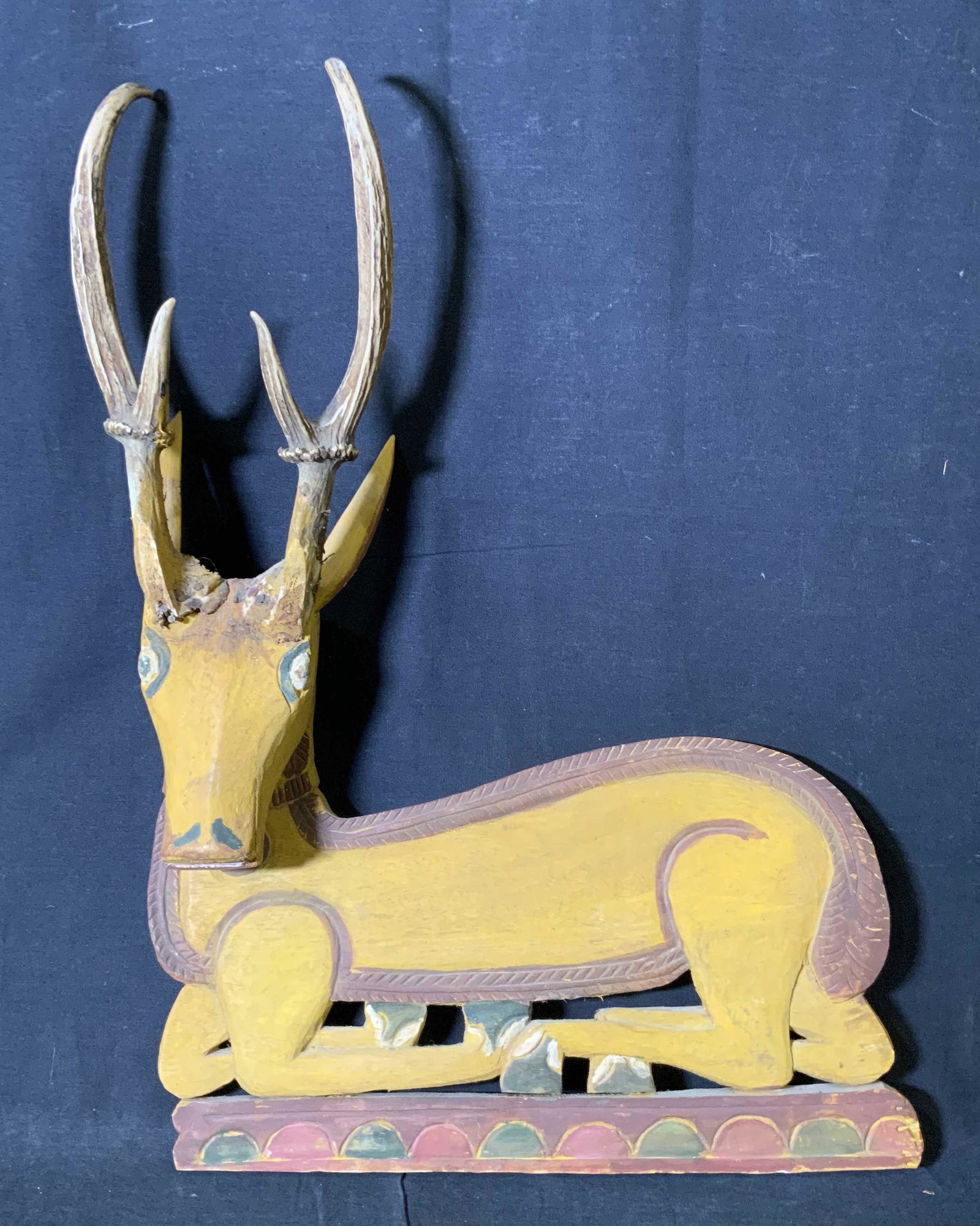 Hand Carved Wooden Deer Sculpture: Hand Carved Wooden Deer Sculpture, no apparent inscriptions or signatures, a seated deer, measures 21 1/4 x 15 5/8 inches, some losses to wood and loose antler, Deer, woodland animal, sculpture, Folk 