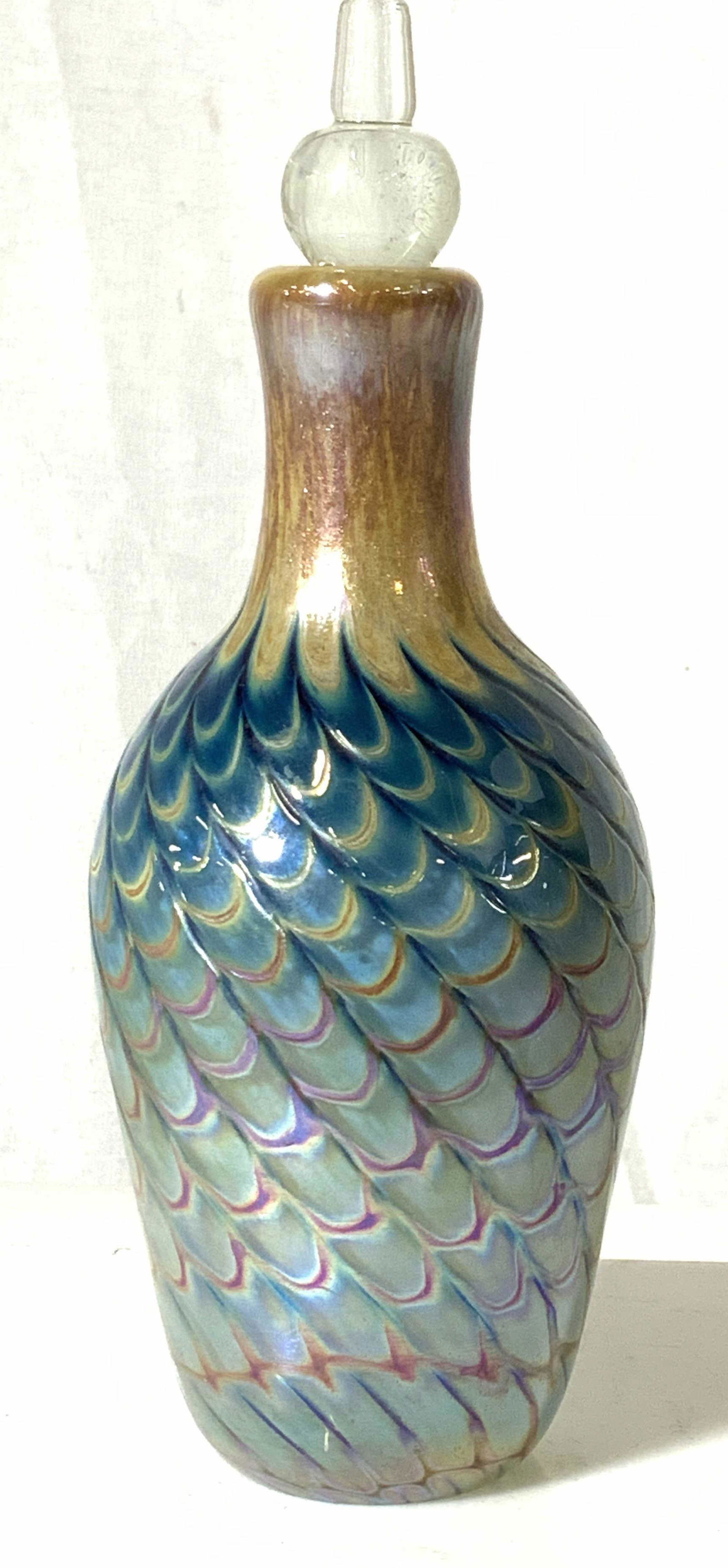 FELLERMAN&RAABE Style Art Glass Perfume Bottle: Artisanal handmade glass bottle with stopper, iridescent blue coating with colorful loop feather pattern on the diagonal. Pontil underside. No marks. Fellerman and Raabe style. App 8 in. Tall, 3.5 in.