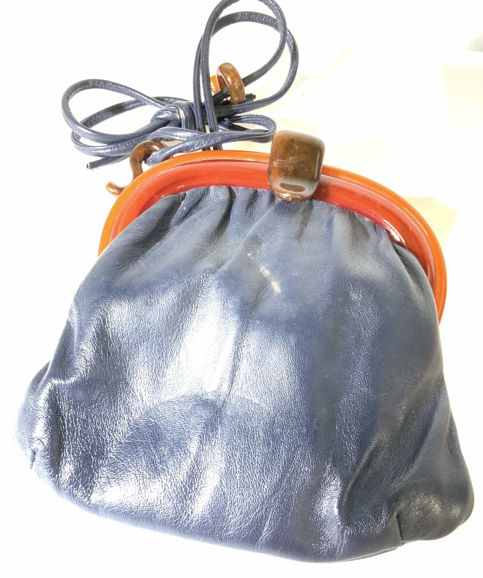 Vintage ANDÉ Leather Purse W Bakelite Handle: Blue leather purse, labeled Andé, Bakelite/Lacquer Handle , needs repair. Other vintage wear, constant with age and use. 9 in. Ht, 9 in. Width. Property of Greenwich Connecticut Estate Clutch, purse,