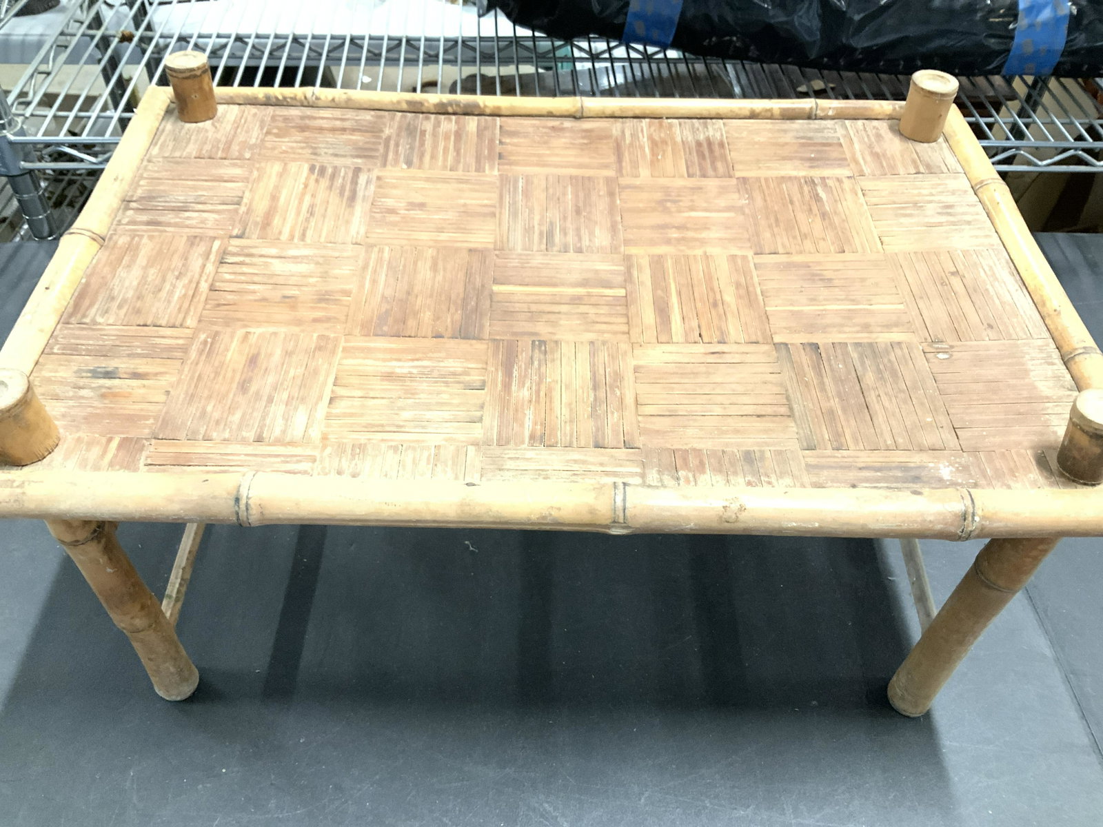 Vintage Handmade Bamboo Standing Tray: Bamboo tray, pillar stand, parquet style flat tray design, tray Ht 10 in. Total ht 11.25 in. Length 22 in. W 14 in. Has wobble. Wood has some ware. Up cycle indoor plant stand, book stand, more Vintag