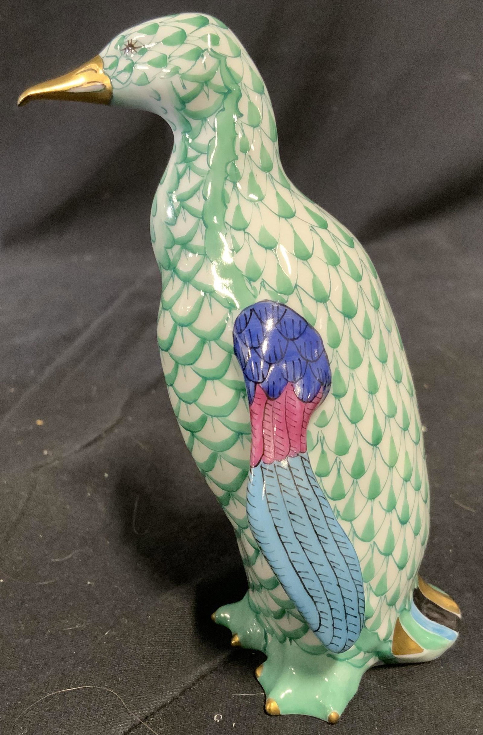 HEREND Hungary Hand Painted Porcelain Penguin: Hand painted HEREND figural. Depicts a Penguin, painted in amber tones, feathers on its wings and tail, as well as its beak and toes are colored with gilt paint. Underside reads as HEREND HUNGARY HAND