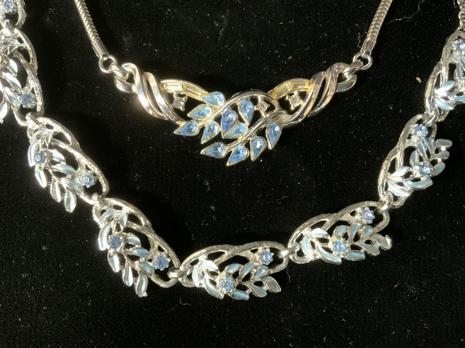 2pc TRIFARI Signed Blue Rhinestone Necklace & More: Lot 2 Blue Rhinestoned Necklaces, TRIFARI & More, inscription to necklace reads ‘Pat TRIFARI Pend’, TRIFARI necklace measures 15 1/8 inches long, other necklace measures 18 7/8 inches long, both i