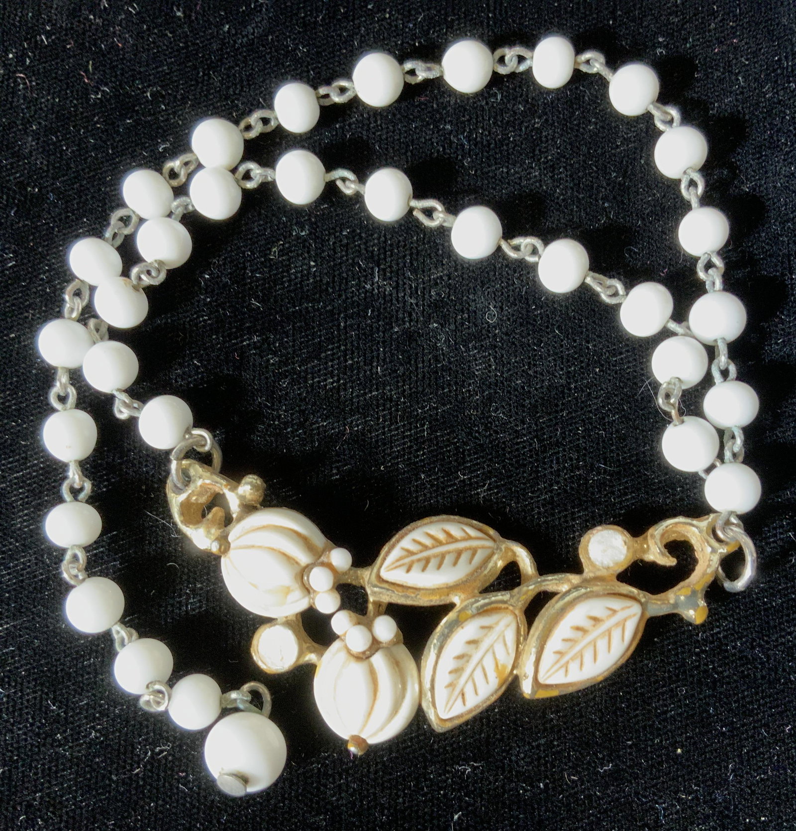 Lot 3 Vintage White Poured Glass Beaded Necklaces: Vintage necklaces, both with white beading , possibly poured Possibly poured colored glass for feature. Necklace with heart shape form surrounded by gold tone links. Hooks over a bead, length app 16 i