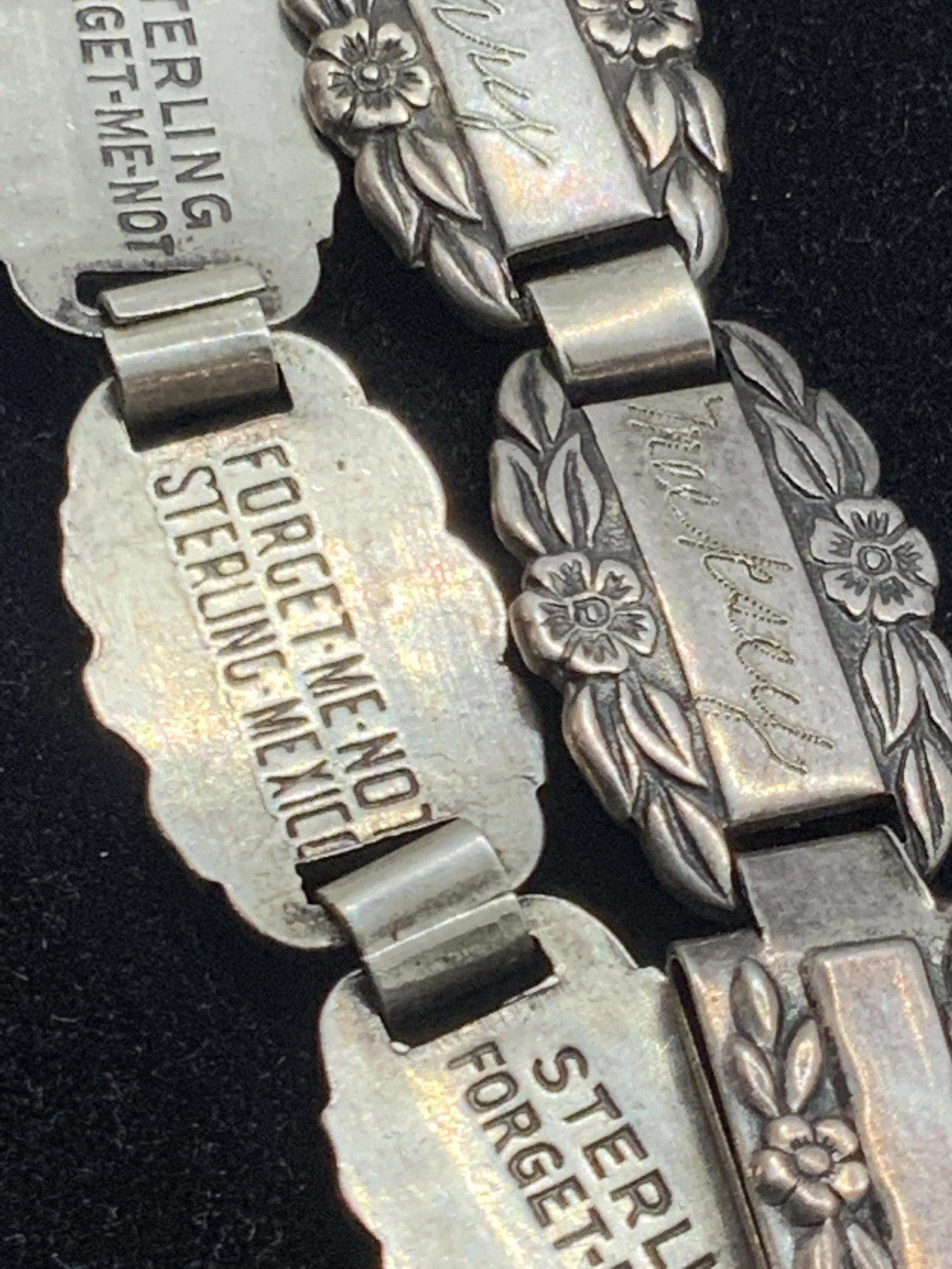 FORGET ME NOT Signed Vntg Sterling Silver Bracelet: A vintage sterling silver metal paneled bracelet accented with etched forget-me-not flowers and engraved names. The frontside of the bracelet features engraved names such as; Mary, Lois, Helen, and mo