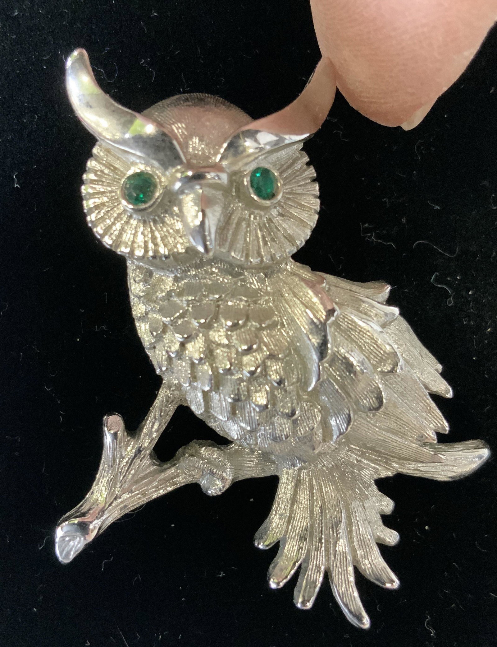 Lot 2 MONET OWL, CRYSTAL FROG BROOCHES, Jewelry: Silver toned brooches- owl has green crystal eyes and Hallmarked MONET on verso. 1.5 in. Ht. Frog in bright polished metal with bright green and clear rhinestones/ crystals. 1.5 in. Brooches, Frog Bro