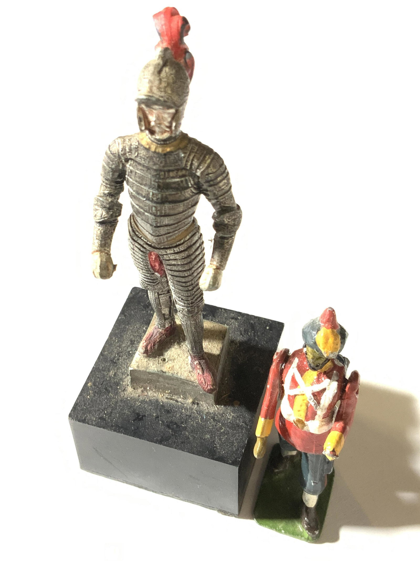 Lot 2 Collectible Vintage Soldier Figurals, Madrid: Two collectible toy soldier figurals. One piece is mounted to a stand. The soldier wears a full coat of armor. Made from a composite material and painted. Underside reads: MADRID, REAL ARMERIA. Arnes 