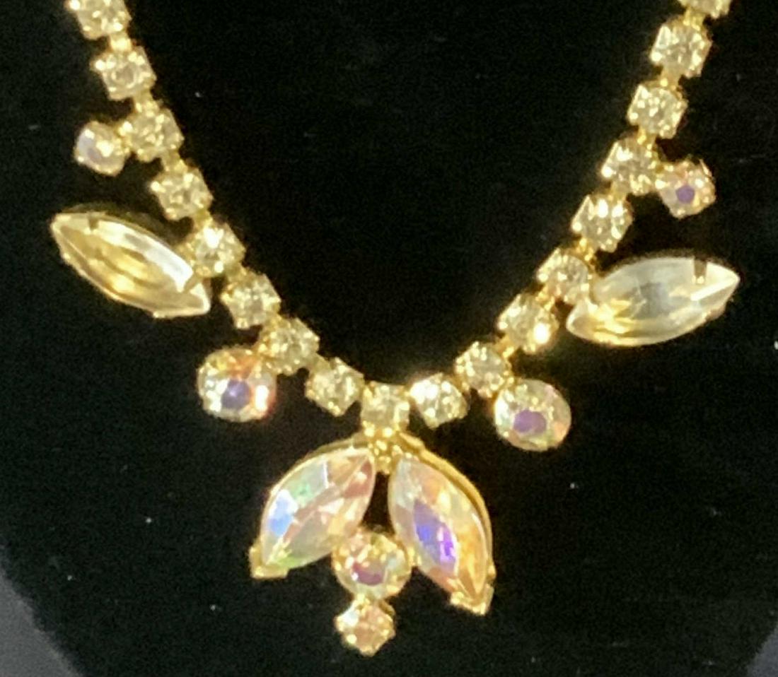 Lot 3 AURORA BOREALIS Rainbow Jewelry: choker necklace, 14 in., center stone bracelet, 6.75 in. L Both are set in gold tone metal. 3 rd piece is a 38 in. Chain with lobster claw clasp- can be worn as a necklace, belt, hair accessory, other