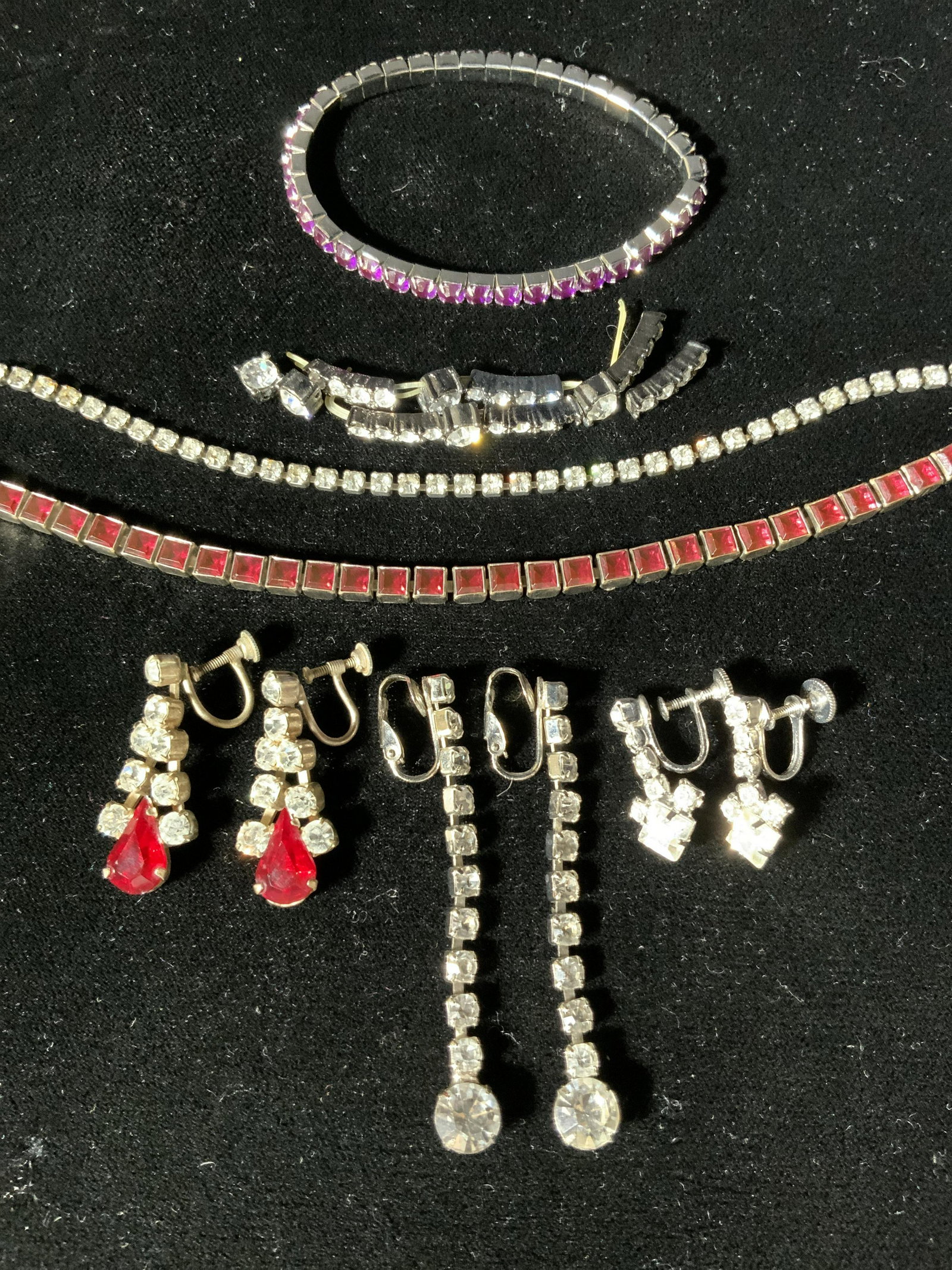 Lot 7 Vintage Rhinestone Jewelry Accessories: Lot 7 Vintage Rhinestoned Accessories, mark to red stoned earrings with screw back clasps reads ‘Made Germany’, measures 1 3/8 x 1/2 inches, red stoned bracelet with box clasp measures 7 1/4 inche