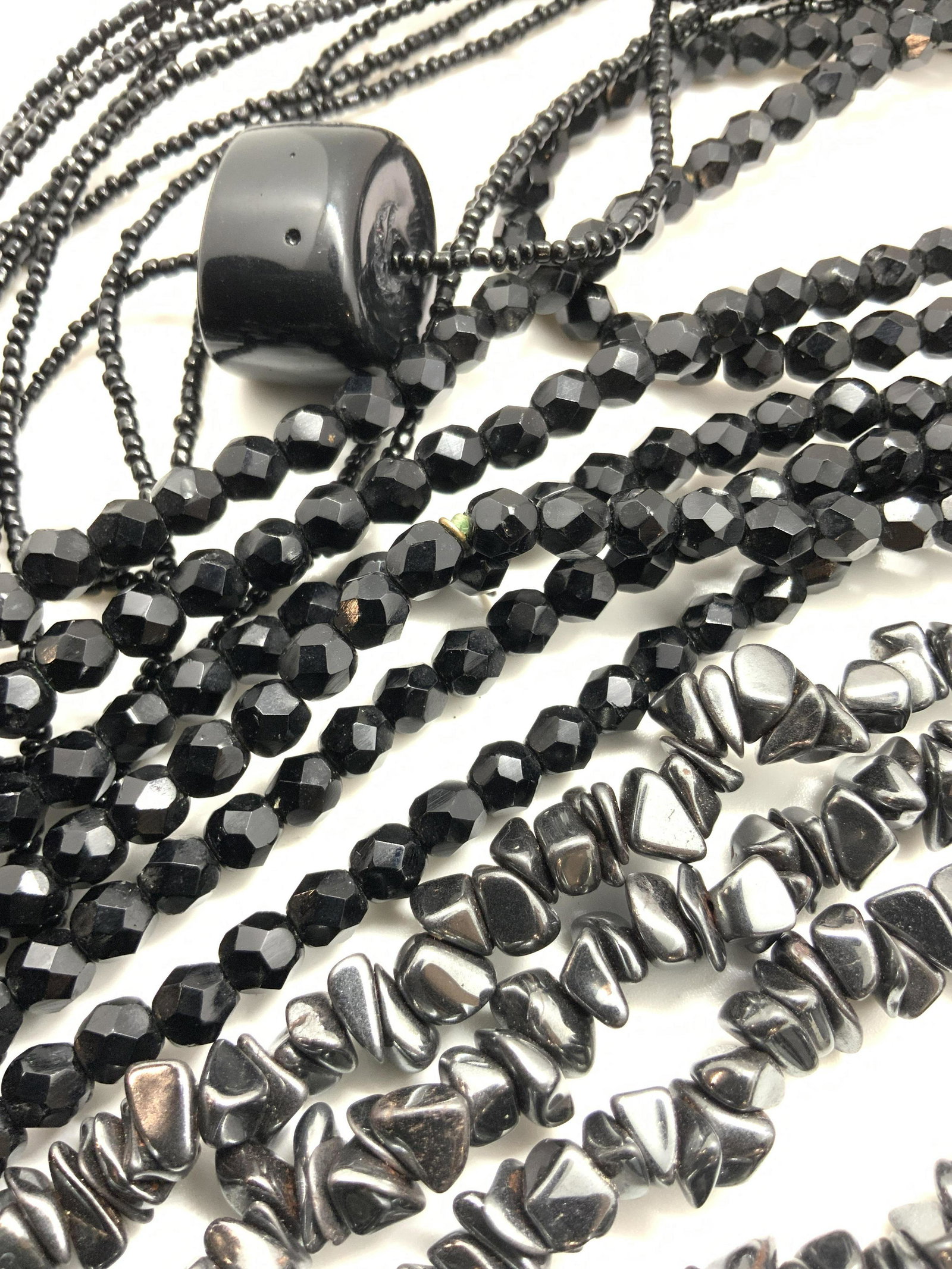 Lot 4 Black Beaded Necklaces, Hematite & More: Four necklaces that can be worn together or separately. One piece is crafted from shard form hematite beads. The other two necklaces are crafted from seed beads and faceted black beads. Seed bead neck