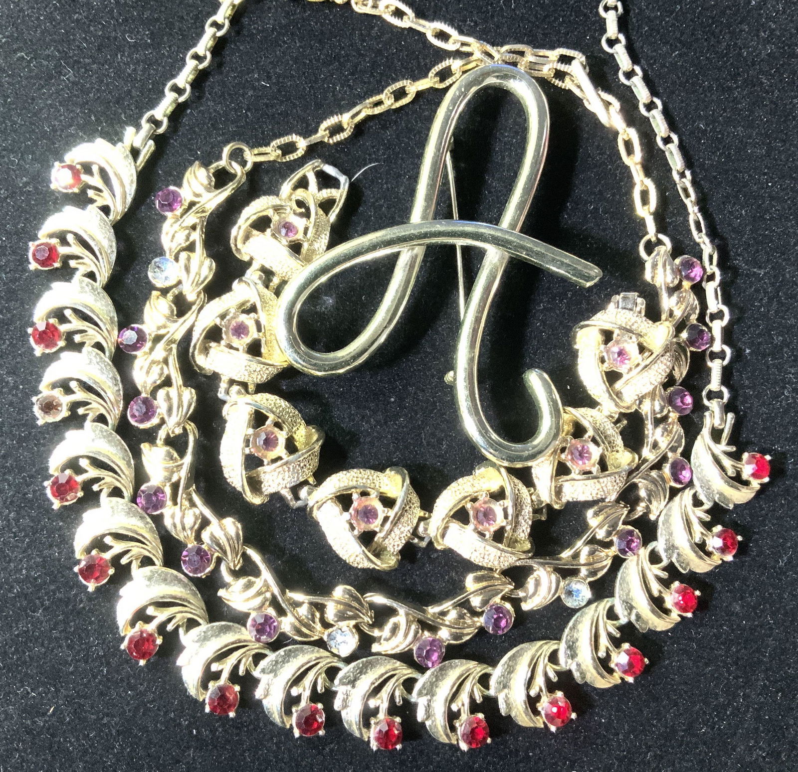Lot 4, Mid Century Rhinestone Jewelry, CORO more: Combine a couple of pieces together or wear separately. Two mid century rhinestone and gold tone choker / collar necklaces, one with amethyst crystals ( 3 need re gluing & in bag), one SIGNED CORO rub