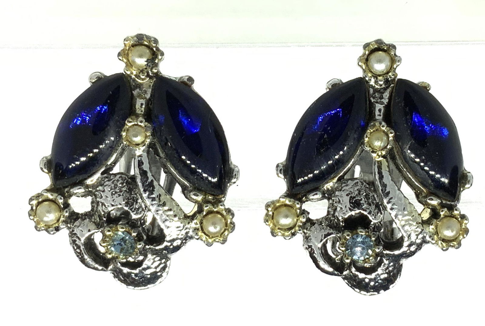 Lot 4 Blue Lucite Ring, Drop Coal Earrings, more: Clever blue group of jewelry staring with mid century blue colored lucite ring, square shape, size 7. Handmade pendant earrings with fish hooks, starring piece appears to be carbonate coal with rainbo