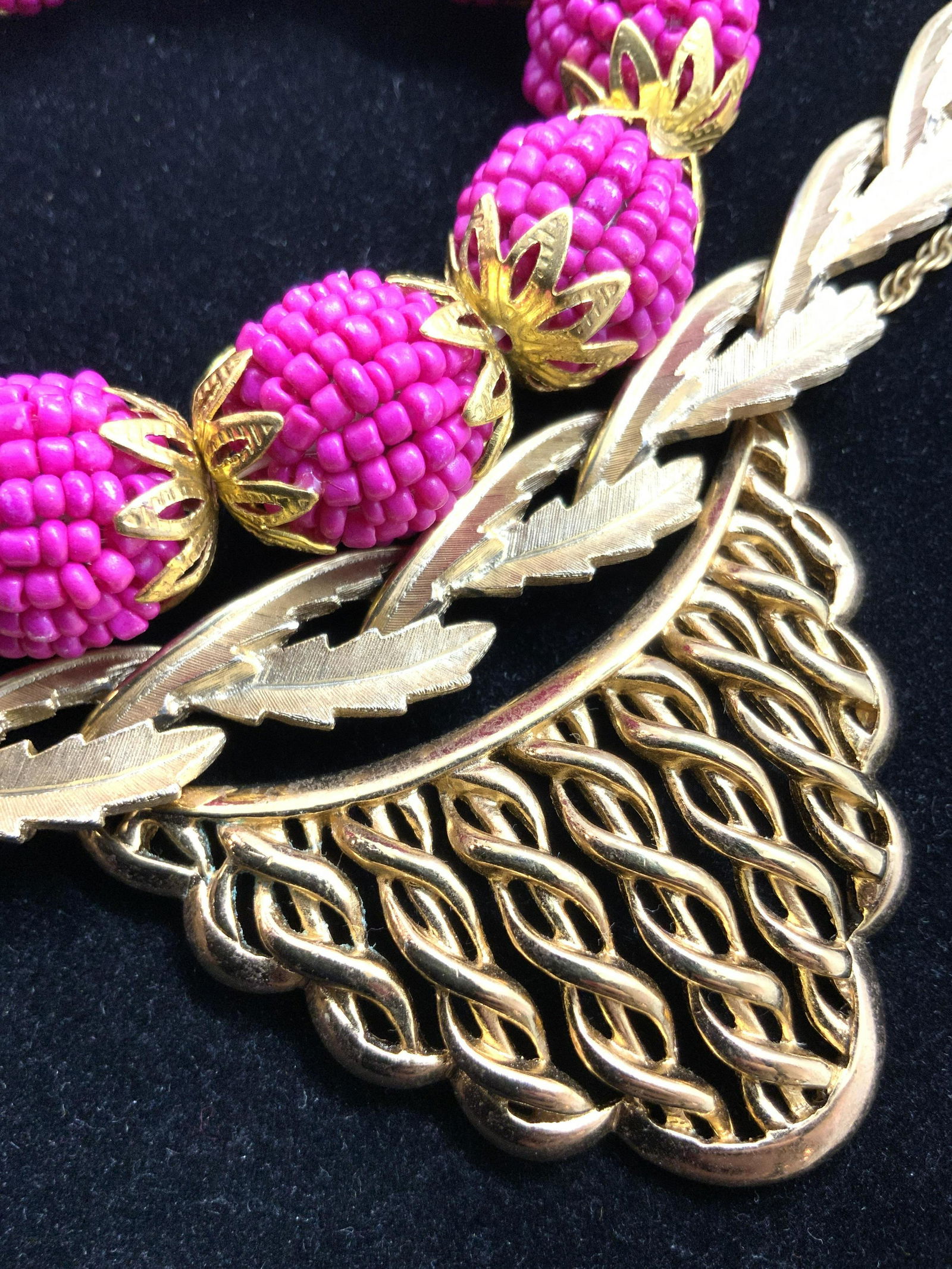 Lot 3 TRIFARI Signed Necklaces & More, Jewelry: Three pieces of jewelry that can be worn together or separately. Two gold tone necklaces, and one pink bracelet. The pink bracelet is beaded with seed beads and accented with gold toned pierced metal