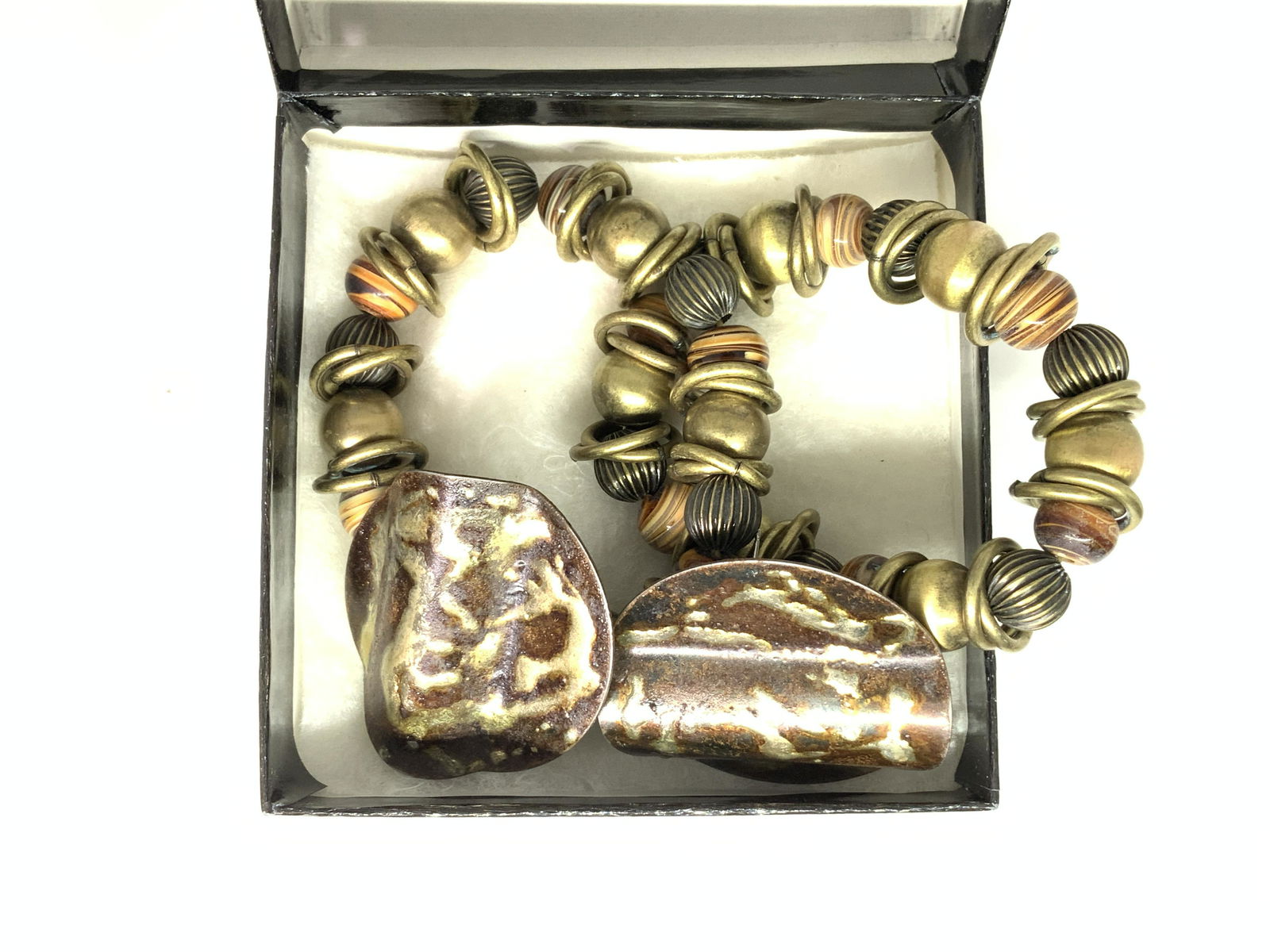 Group 3 Artisanal Metal Earrings,Stretch Bracelets: Pair pierced earring and 2 matching stretch metal bead and ceramic bead Bracelets. Brass toned metal, bracelets fit almost any size. Chunky artsy jewelry. 1.5 in. Diameter flat disc enamel earrings wi