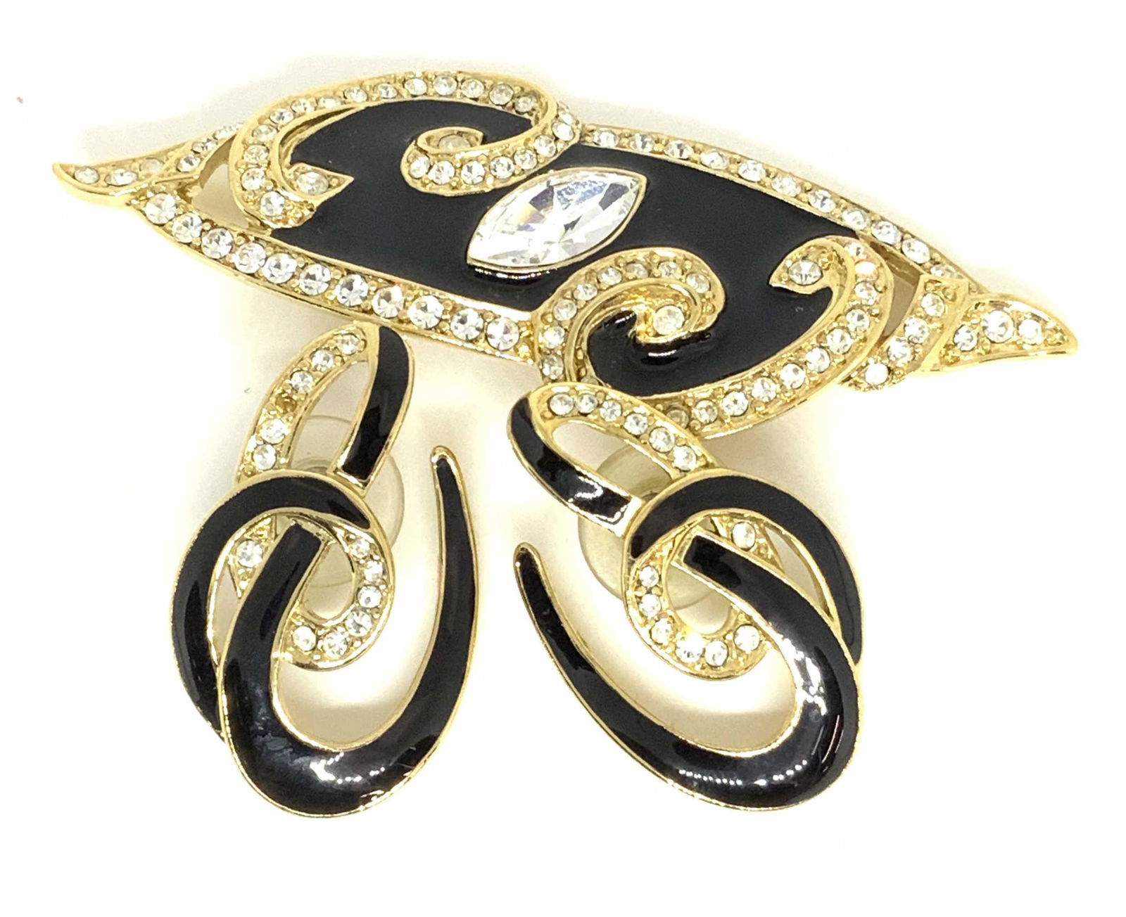 Set2 TRIFARI Sign Vintg Abstract Earrings & Brooch: A matching set of abstract form pierced earrings and a brooch. All pieces are comprised of polished gold tone metal, black enamel, and faceted colorless crystals. The undersides of the earrings are po