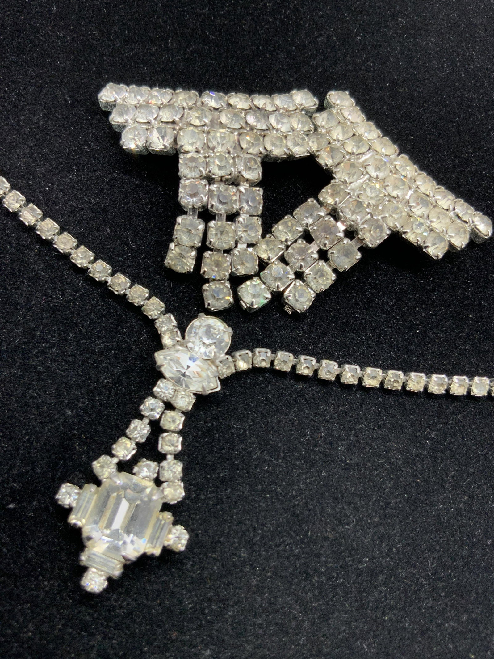 2pc Vintage Rhinestone Necklace & Shoe Clips: Two pieces that can be worn together or separately. Both feature colorless, faceted rhinestones. Crafted from silver tone metal. The necklace is choker style and secures with a fishhook clasp closure.