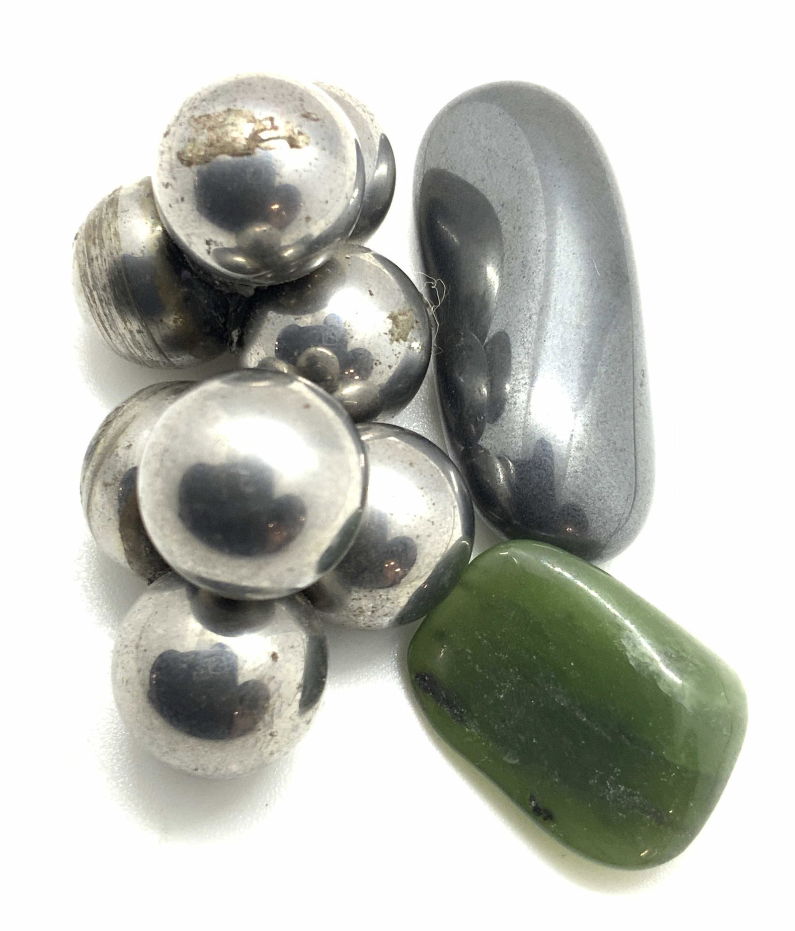 Lot 4 Natural HEMATITE & GREEN STONE: Three pieces are hematite. Two of the hematite pieces are clusters of spheres connected together, possibly hematite, possibly metals. Mild wear. Another piece is a polished oval shaped piece of hemati