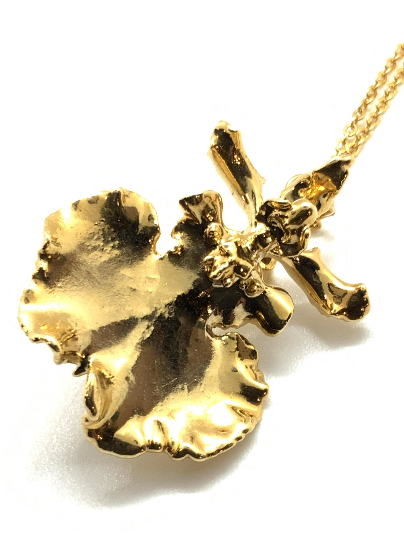 Lot 3 Gold Toned Jewelry, 22k GP, Monet, More: Three pieces of jewelry that can be worn together or separately. All pieces crafted from gold tone metal. The necklace features a 22k gold plated brooch / pendant. The piece is signed on the underside