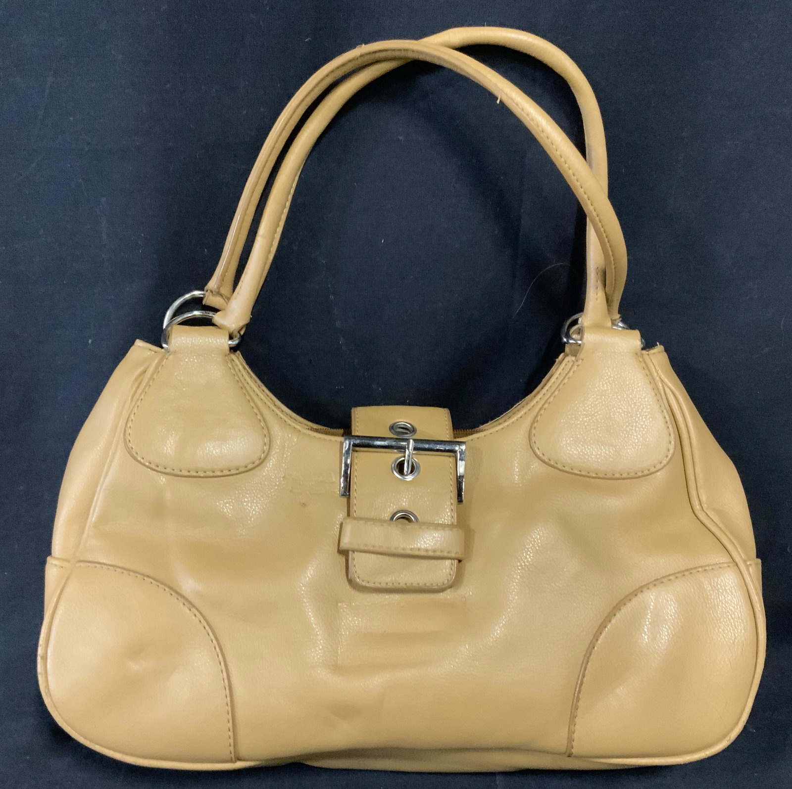 PRADA Style Shoulder Bag purse: Leather shoulder bag in the style of Prada. Clasp buckle secured to bag with a magnet, bag reads as PRADA. Measures approx 16 inches H, and 16 inches W. Wear is consistent with use. Women’s handbag,