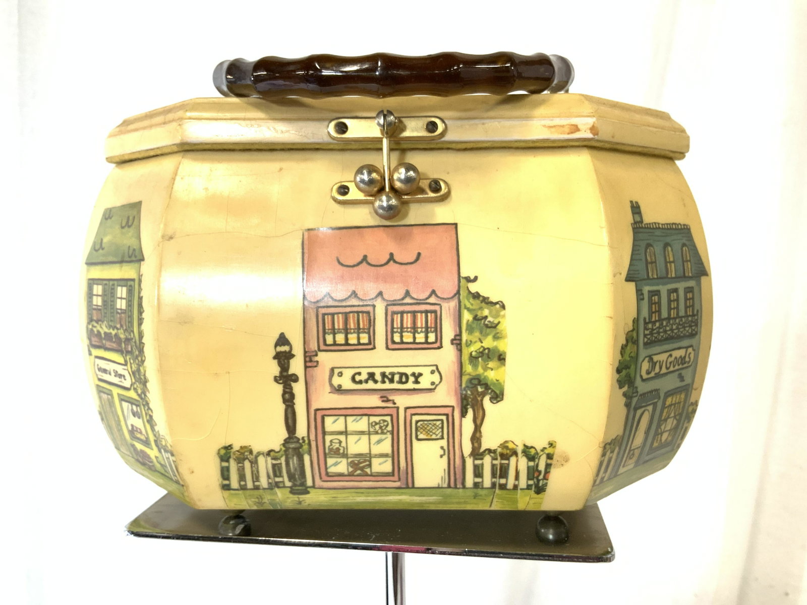 Vintage Wooden Decoupage Purse ‘Store’ Box, 1940s: Wood Decoupage Box / Case Style Handbag with Bakelite Handle and rest on ball feet. Decoupage buildings of small town store buildings - candy store, general store, dry goods, P.S. 82 School, Apothocar
