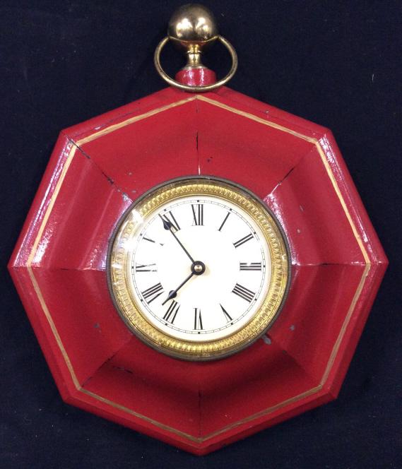 Red Toned Metal Hanging Wall Clock: Wall clock is red and gold toned. Clock face is cream toned with black toned Roman numeral Detail. Piece measures approx 17 inches tall. home accent, wall hanging, clock, wall clock, 6