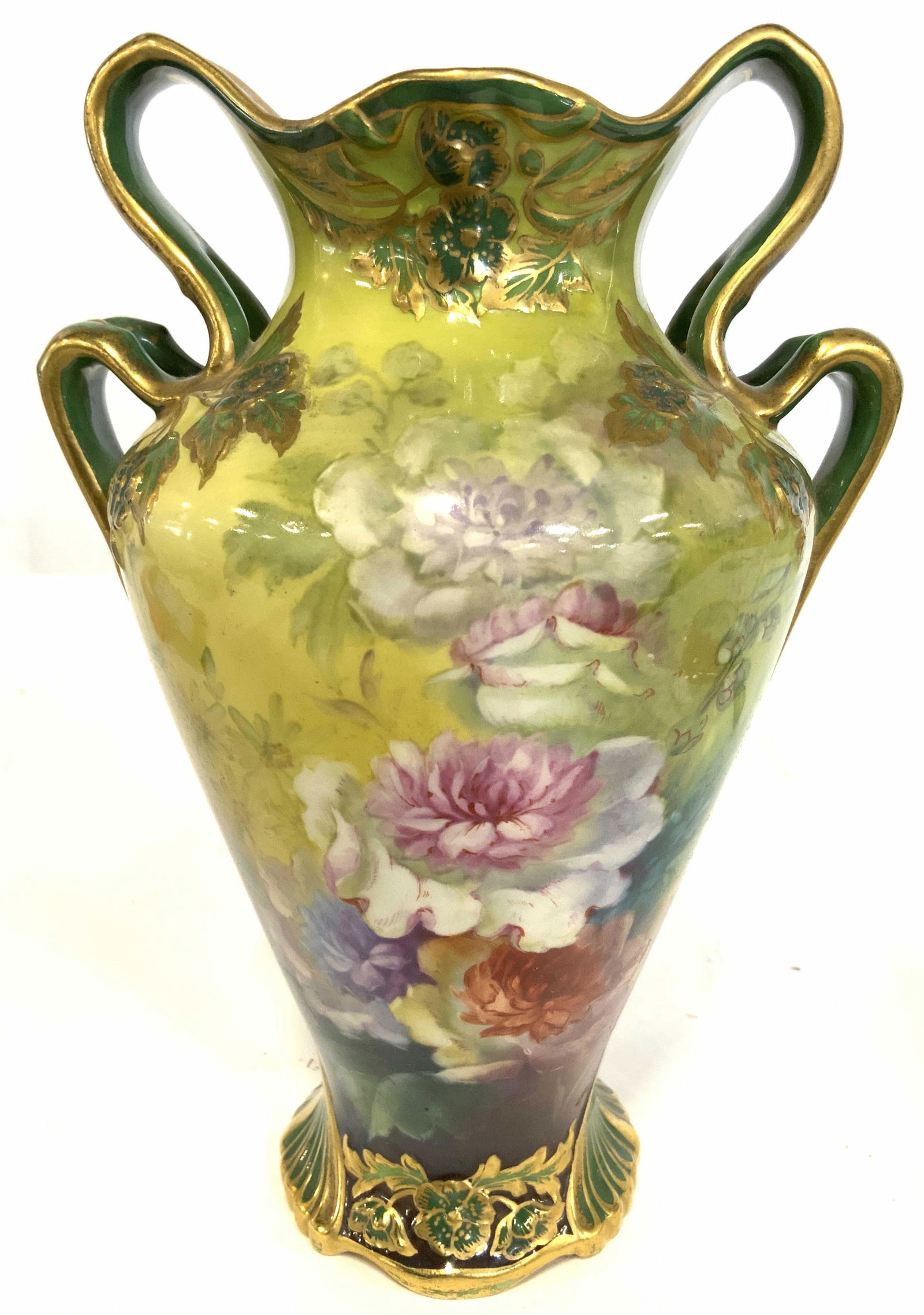 ROYAL BONN GERMANY Porcelain Vase W Handles: Underside of vase is marked ROYAL BONN GERMANY. Piece has intricate multi toned floral vine and leaf detail. Vase has handle on each side. Piece has gold leaf accent detail at rim, on handles, & at ba