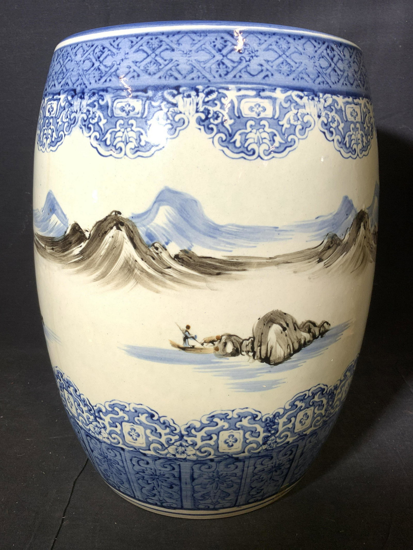 Vintage Hand Painted Porcelain Garden Stool: Garden stool is porcelain. Piece is vintage possibly antique. Contains some hand painted elements. Stool has intricate geometric, floral & leaf detail. Piece also has detail depicting mountains & figu