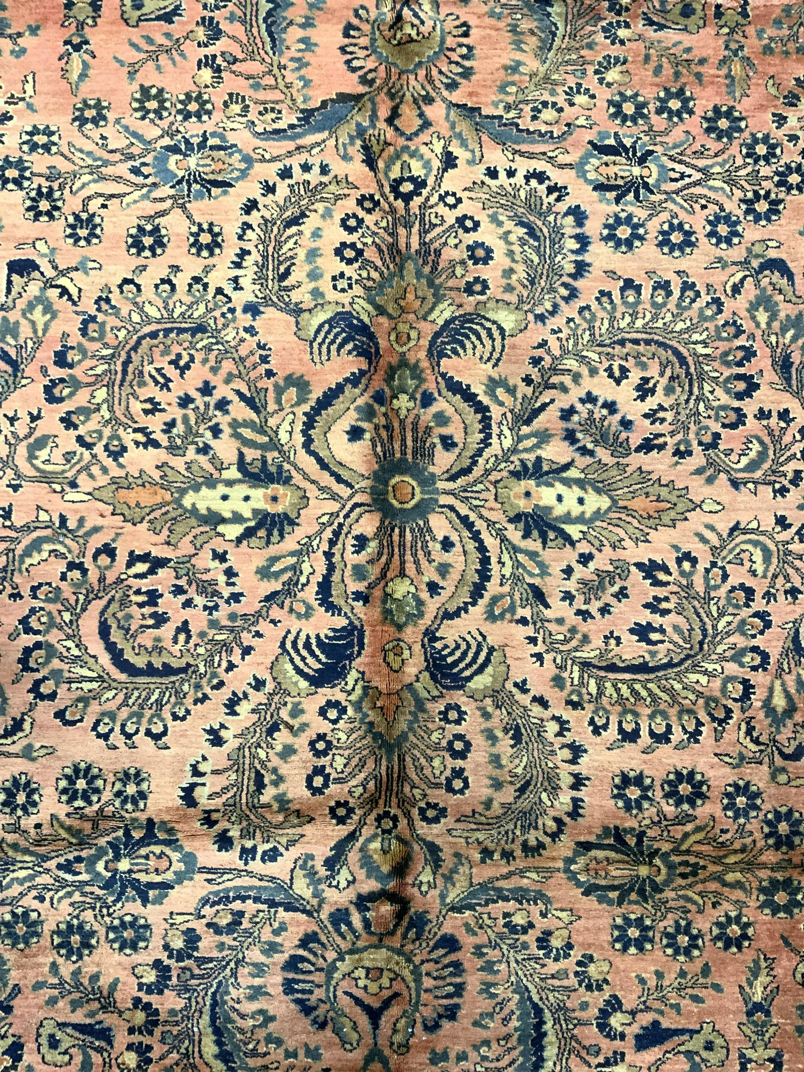 Antique Persian Room Size Handmade Wool Rug: Rug is wool and handmade. Piece is vintage possibly antique. Piece contains intricate multi toned floral vine and leaf detail. One side of rug has small fringes. Rug appears to be Persian. Rug, carpet