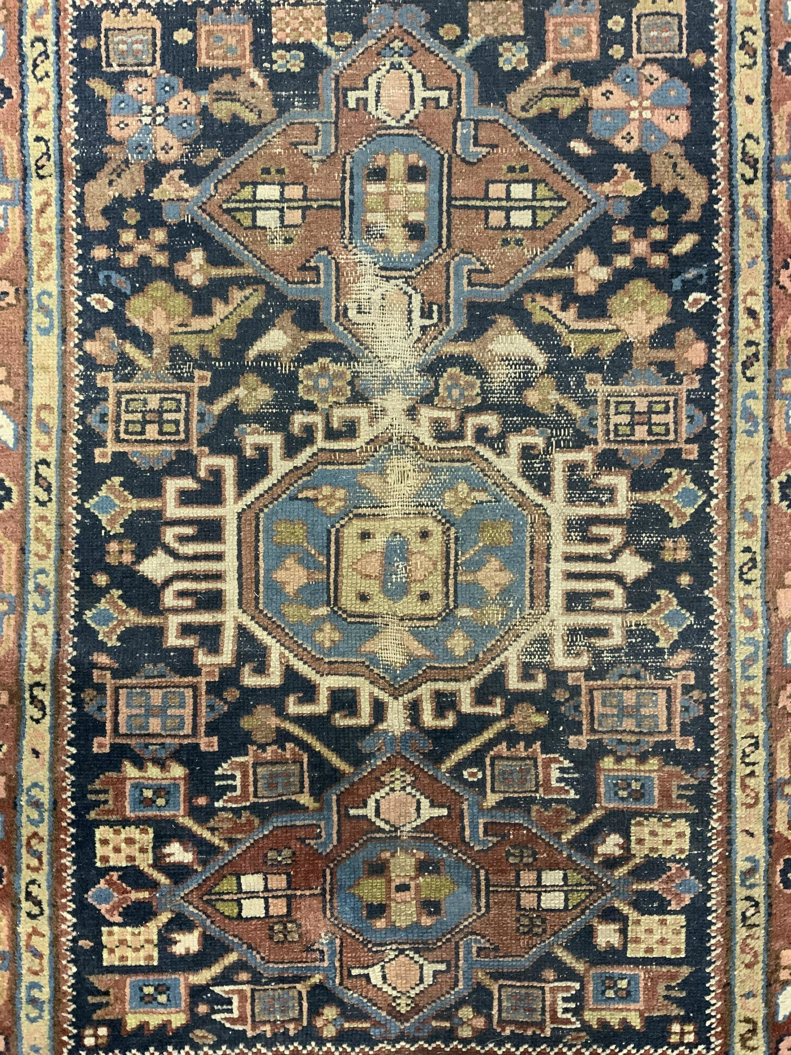 Vintage Handmade Wool Rug Carpet: Rug is wool and handmade. Piece is vintage possibly antique. Rug appears to be Turkish. Rug contains multi toned geometric & floral detail. Piece measures approx 51 inches long 39 inches wide. Rug, ca