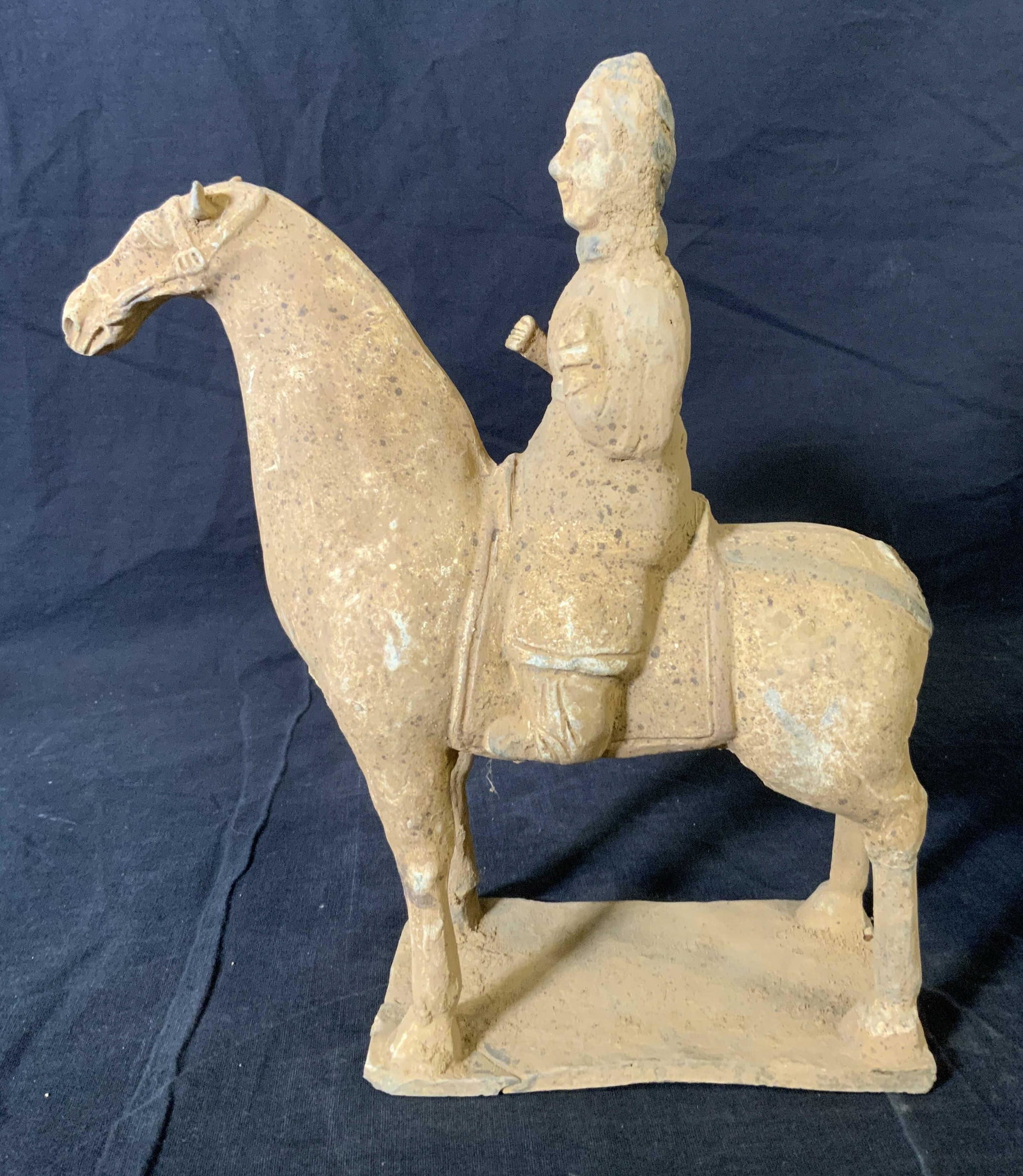 Chinese Ceramic Horse and Rider Sculpture: Chinese Ceramic Horse and Rider Sculpture, no apparent inscriptions or marks, subject a man riding a horse, measures 11 1/8 inches tall x 9 5/8 inches at widest point, sculpture missing its tail, crac
