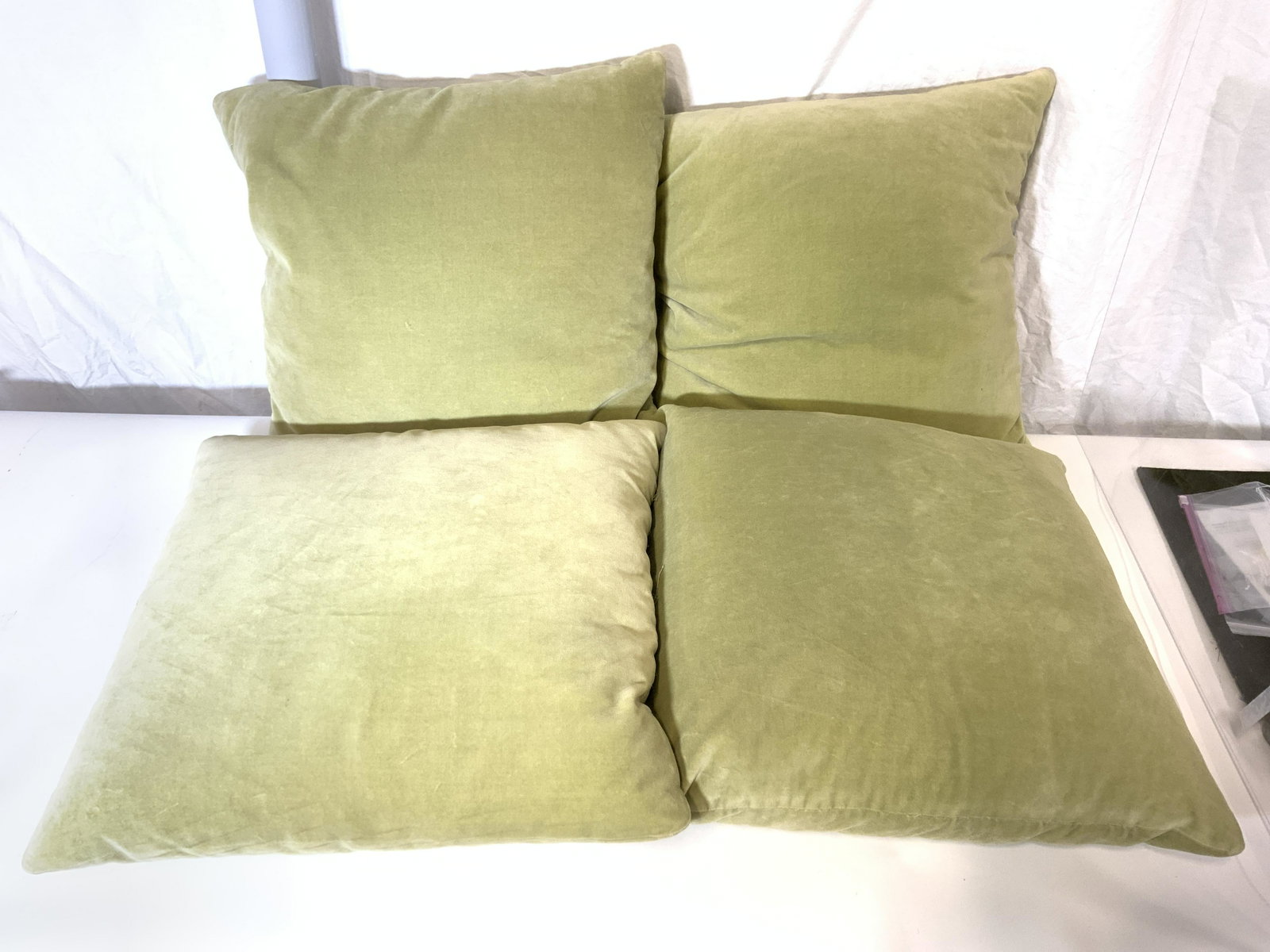 Set 4 Green Sofa Pillows: Lot includes 4 pillows. Each are light green toned. Pillows appear to possibly be crushed velvet. Each measures approx 21 inches square 7 inches deep. Pillows, set of pillows, couch pillows, throw pil