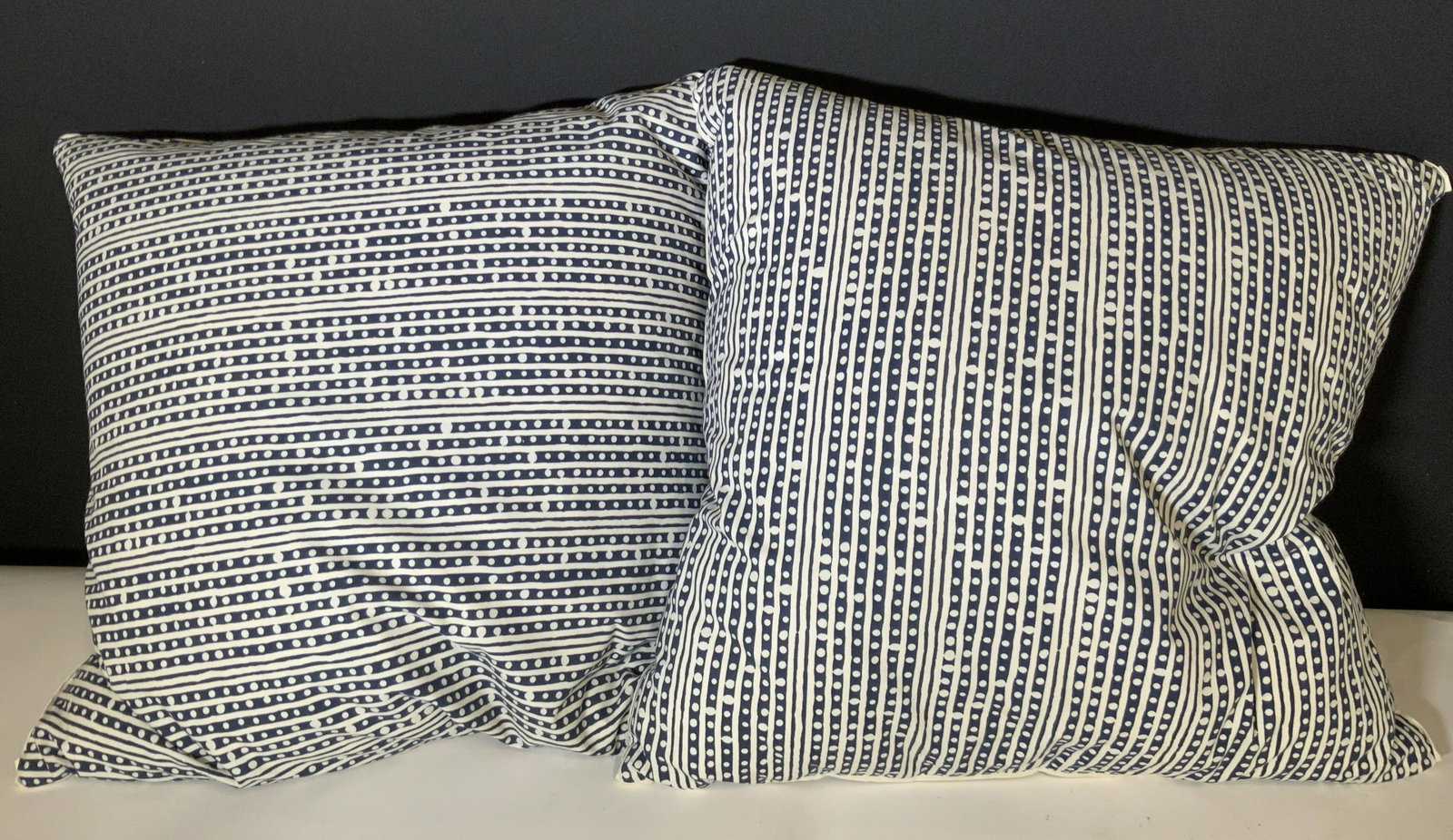 Pair Oversized Navy & White Spotted Throw Pillows: Two navy & white throw pillows. Designed with bands and dots. Pillows are sewn shut. Approx. 18 x 18 in. Mild discoloration. Throw pillows, sofa decor, couch accessories, bedroom accessories, bedroom 