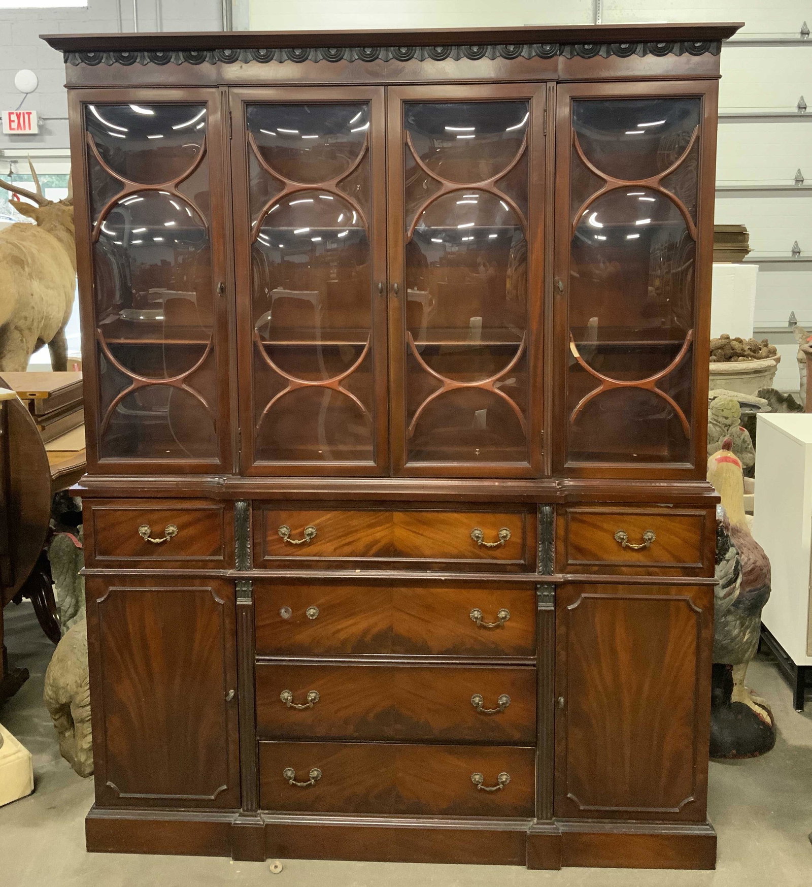 Vintage EBERT FURNITURE Wooden China Cabinet: Backside of piece has tag which reads EBERT FURNITURE CO. Top half of piece has 4 windowed doors. Lower has has 6 drawers each with 2 gold toned brass handles and hand dovetailing. Lower half also inc