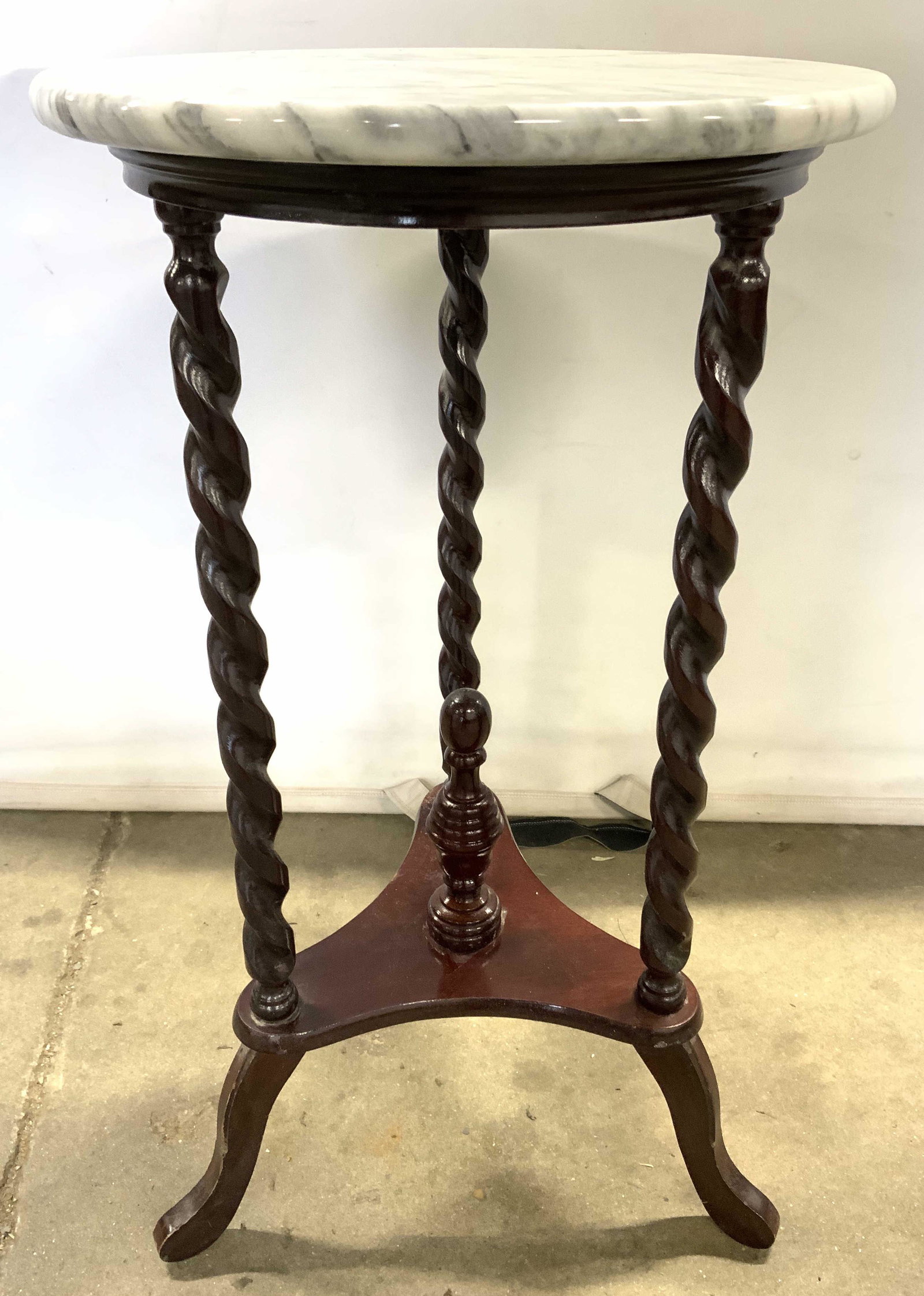 Vintage Marble Top Wooden Pedestal Side Table: Pedestal is vintage. Piece has carved twisted wooden detail. Center of stretcher has finial structure. Tabletop is circular and marble. Side table, end table, pedestal, vintage accent table, occasiona