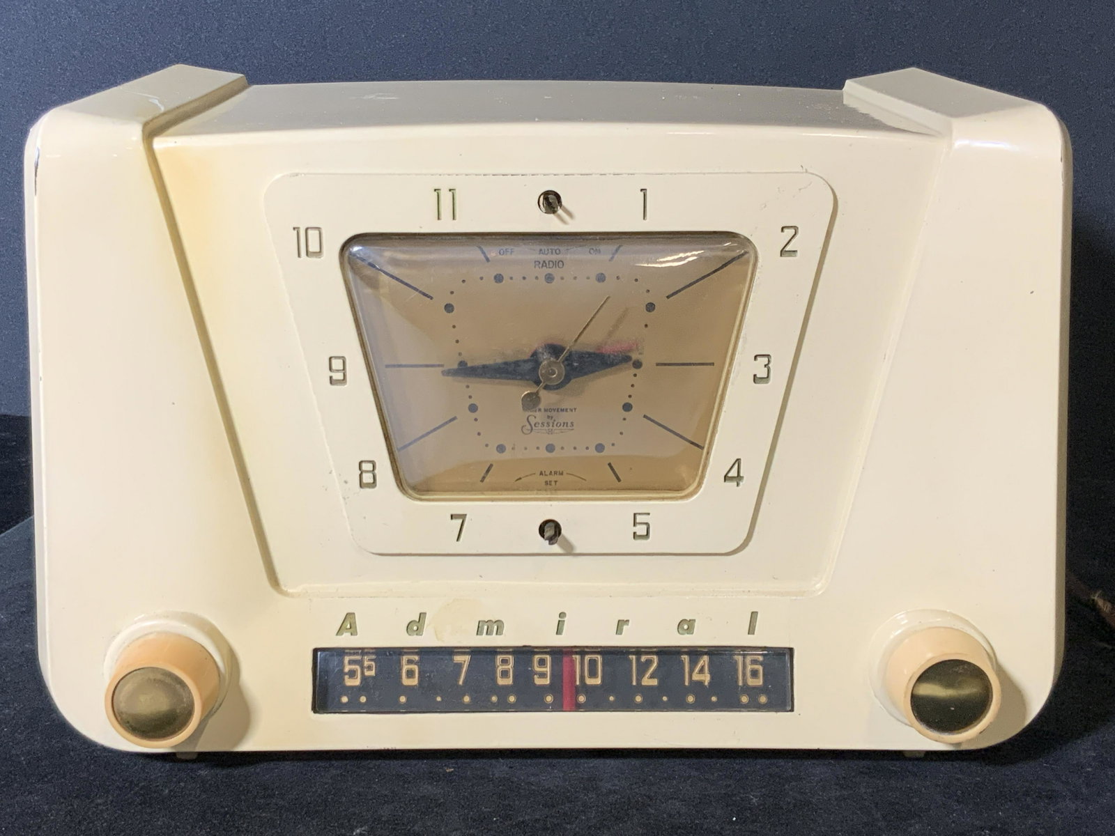 Vintage ADMIRAL MODEL 5X23 Collectible Radio: Circa 1953 vintage Admiral Model 5X23 radio. Crafted from ivory toned Bakelite. Two knobs and clock face on the front. Knobs still turn. Front reads, Admiral. Clock face reads, Timer Movement by Sessi