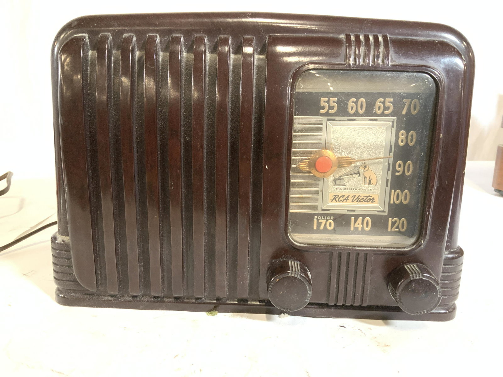 Collectible RCA VICTOR 1X Nipper Radio, c1940: Art Deco design and the famous nipper dog dial scale 9in. wide, in.tall x 6in.deep Made of brown BAKELITE, volume dial and channel dial. Art Deco dial hand. No back Part of a larger collection of vint