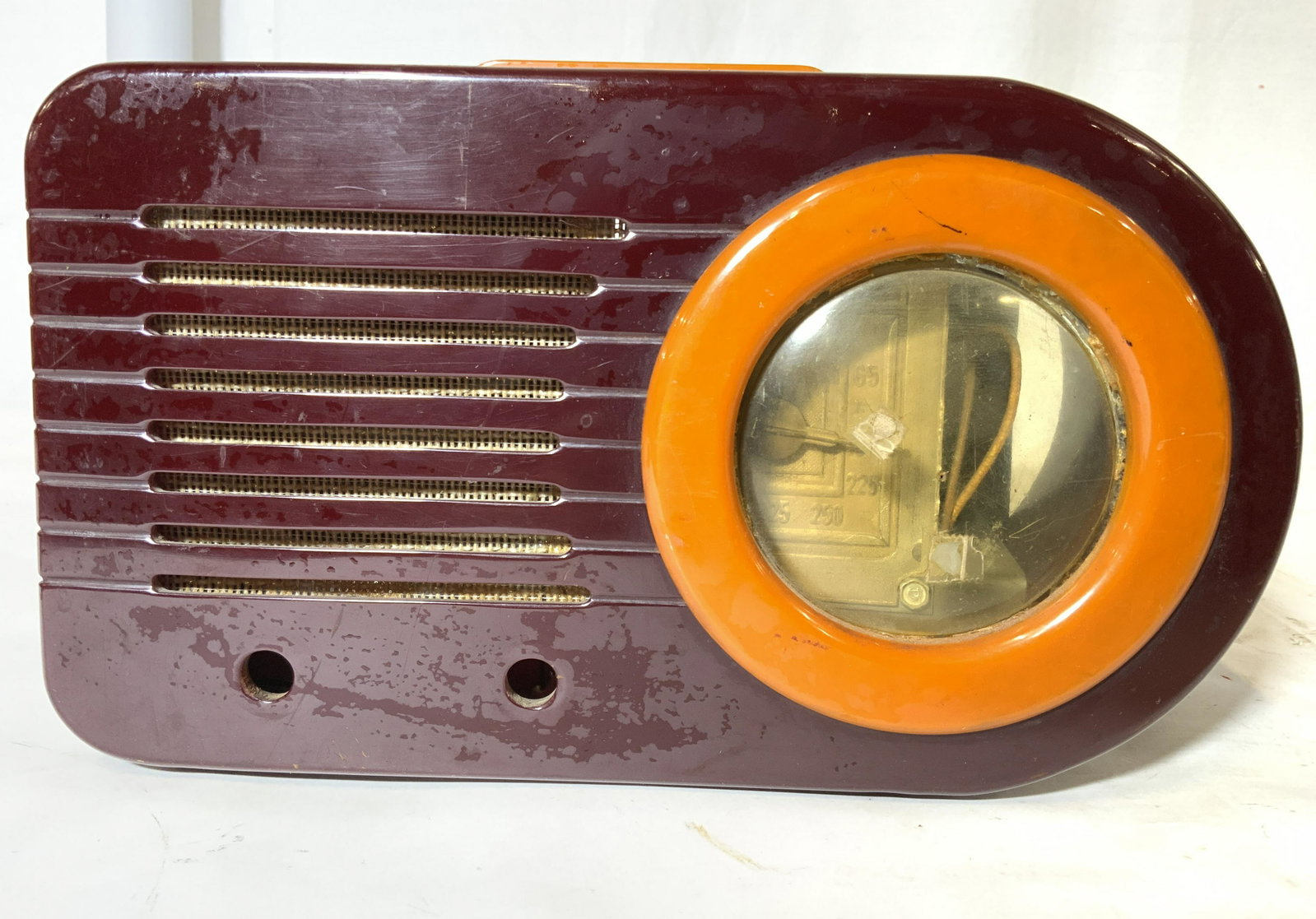 Collectible FADA 1000 Bullet Catalin Tube Radio: 1946 Fada Model 1000 AM Bullet Radio in Butterscotch and burgundy, made of Catalin. Stream lined designs of the Art Deco era and one of the most recognized Catalin or Bakelite radios from the 1930’s