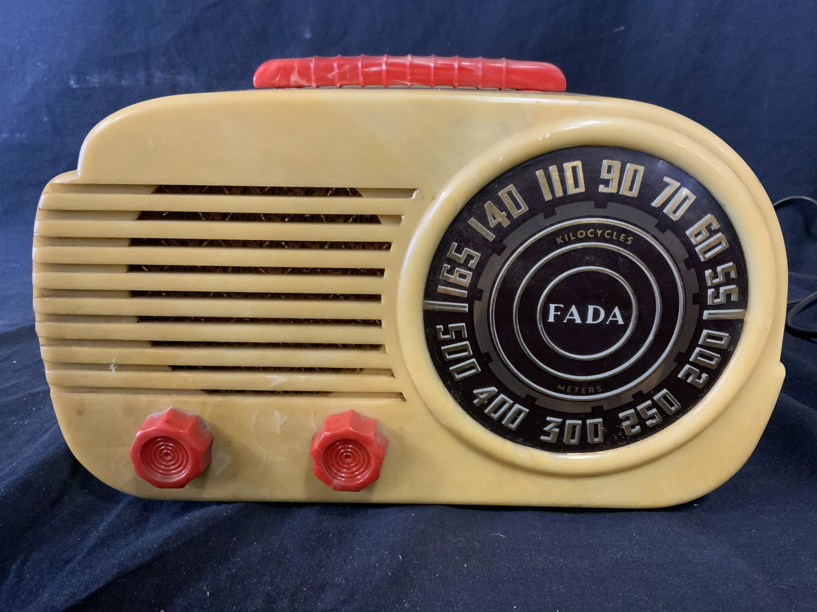 Vintage FADA Model 845 Tube Radio: FADA 845AR Circa 1946-1947. Piece has red handle & knobs, alabaster tone body, gold toned letters & numericals. Part of a larger collection of vintage & antique radios. Property of a multi generationa