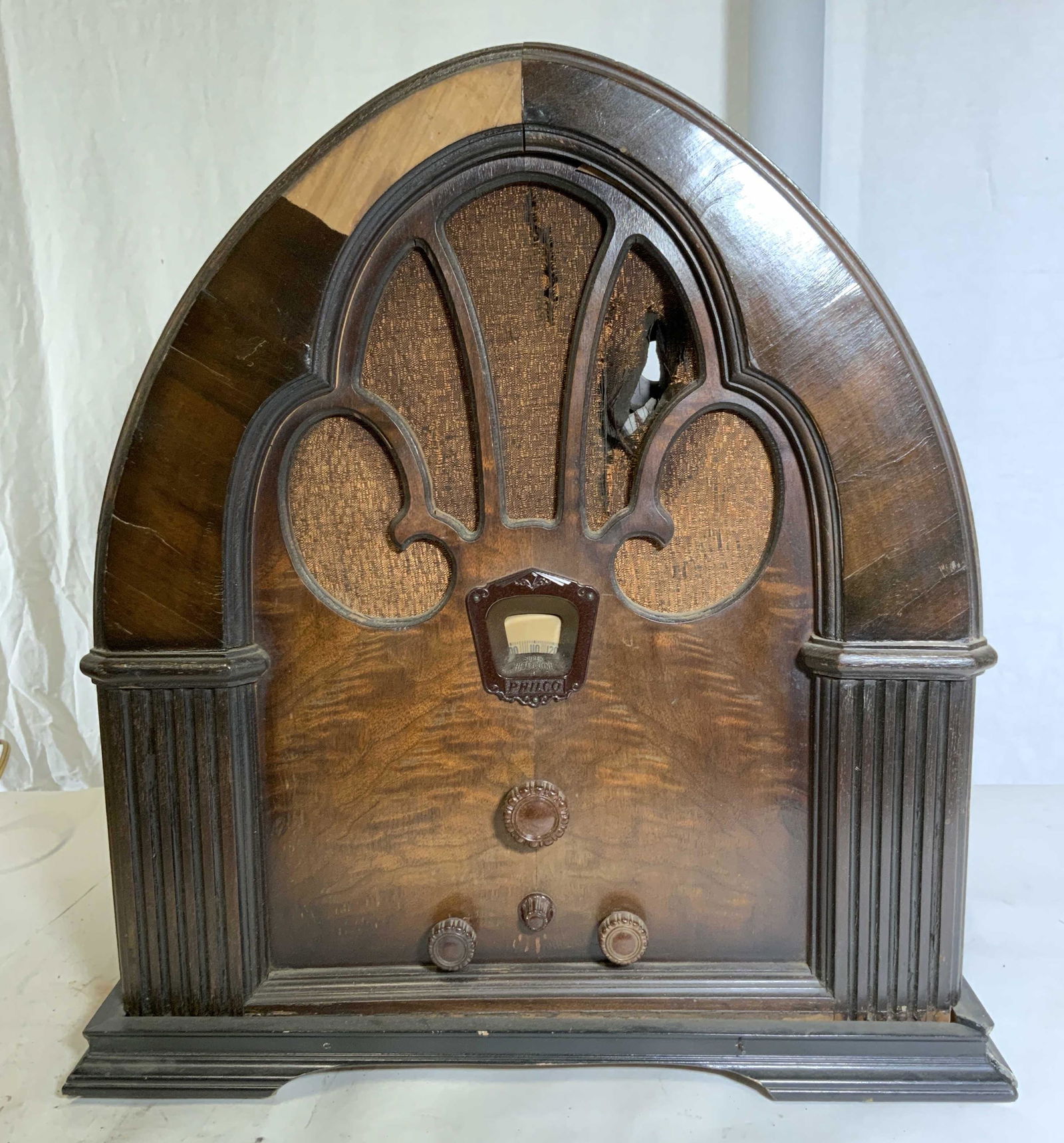 Vintage PHILCO Model 90 Cathedral Style Radio: Vintage PHILCO radio, initially released in 1931. Casing is wood, mahogany toned, some loss to casing present. Some loss to fabric present on radio face. Label inside or radio reads as PHILCO RADIO MO