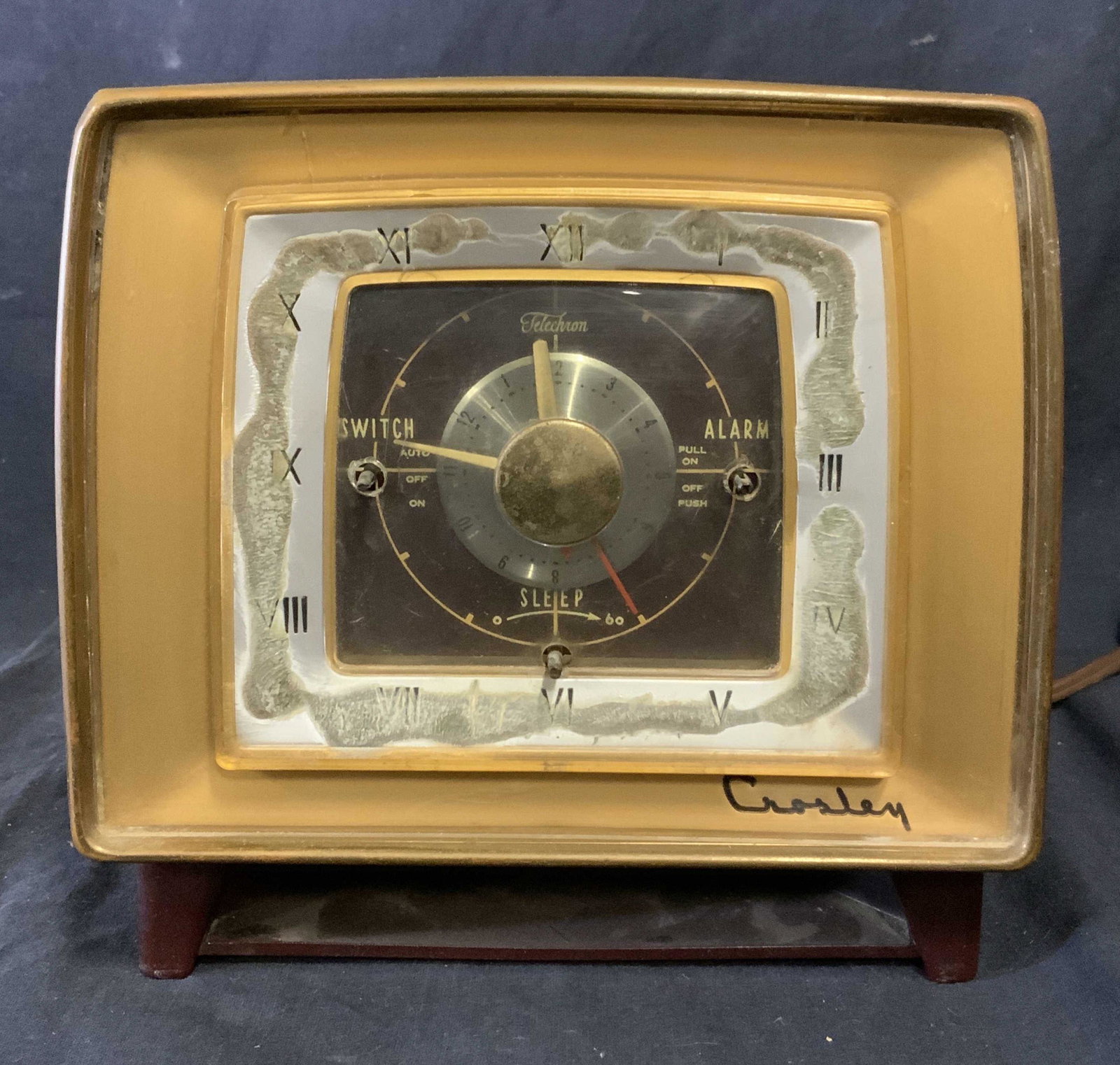 Vintage CROSLEY F25BK Alarm Clock Radio: Vintage CROSLEY alarm clock radio. Clock face knobs are missing. Reads as TELECHRON, SWITCH, ALARM, SLEEP. Time set knob is located on clock back, tuning and volume knobs are on the sides. Measures ap