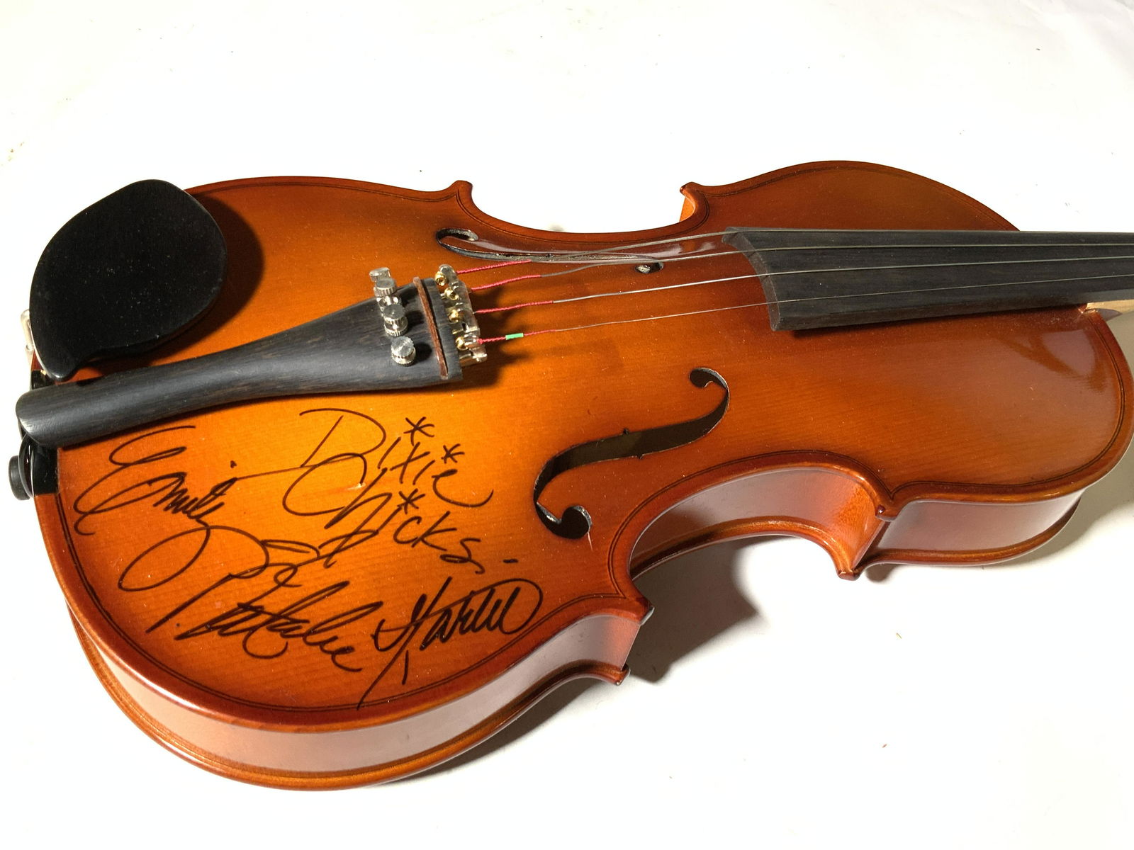 DIXIE CHICKS SIGNED Leon Aubert Violin W. Case: A Leon Aubert stradivarius violin with a signature reading: DIXIE CHICKS, EMILY, NATALIE, MARTIE. The signature appears to have been done in black marker. Little asterisk marks are in place of the dot