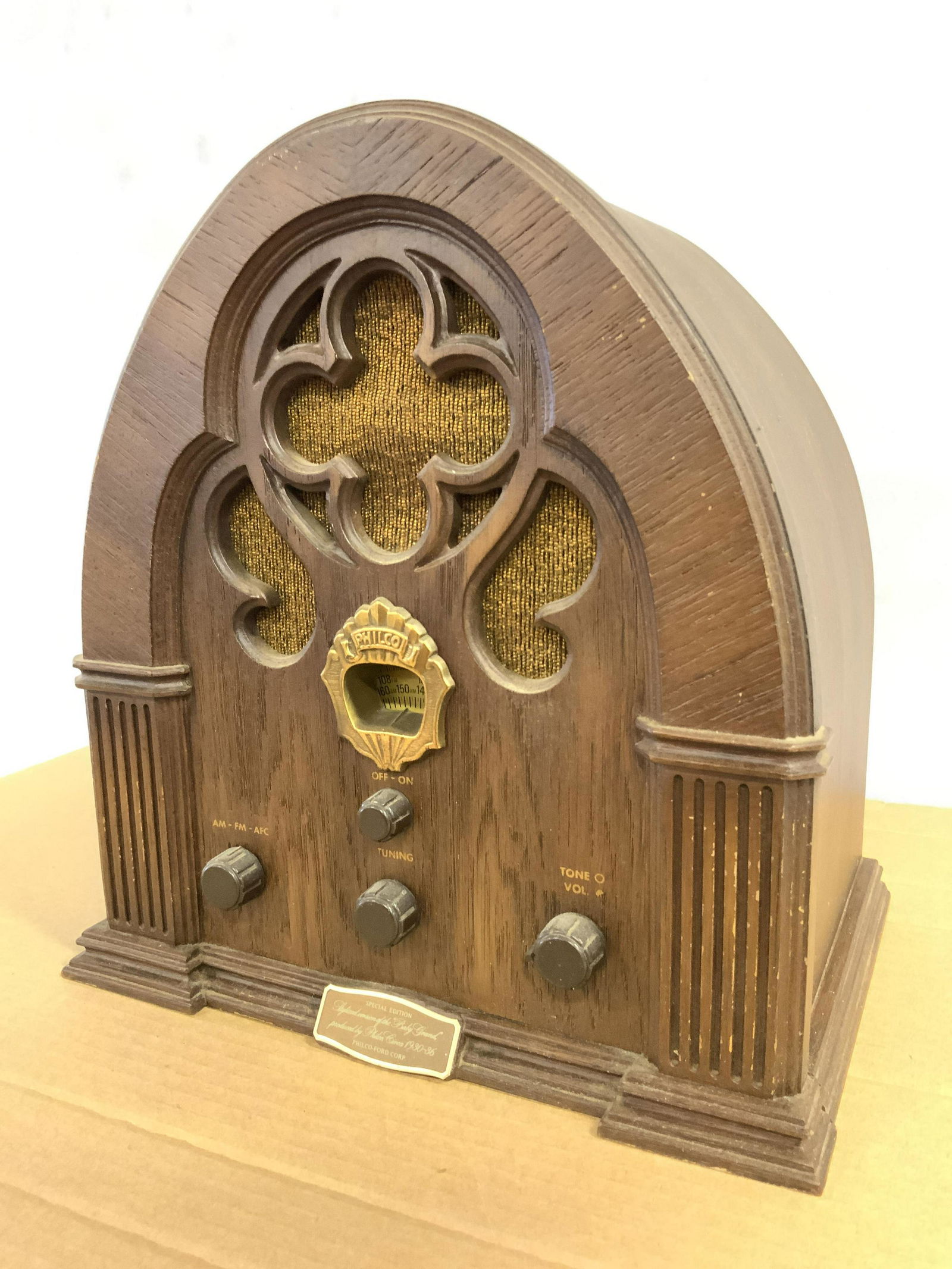 Vintage PHILCO Model R-90 Tube Radio C 1931: Tag on backside reads PHILCO R-90. Piece has wooden shell possibly veneer. Front of radio has 4 knobs. Small plaque on front reads “STYLIZED VERSION OF THE BABY GRAND PRODUCED BY PHILCO CIRCA 1930-1