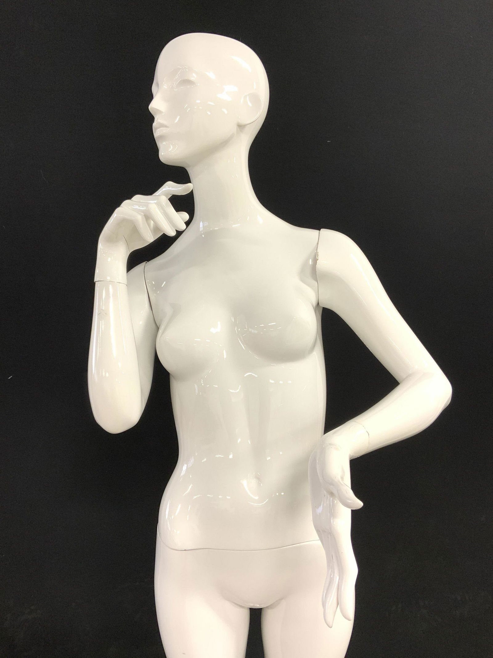 Life Size Articulated Female Polychrome Mannequin: Mannequin is life size. Mannequin structure appears to be polychrome. Piece is life sized & white toned. Base is silver toned & metal with square shape. Whole structure measures approx 71 inches tall