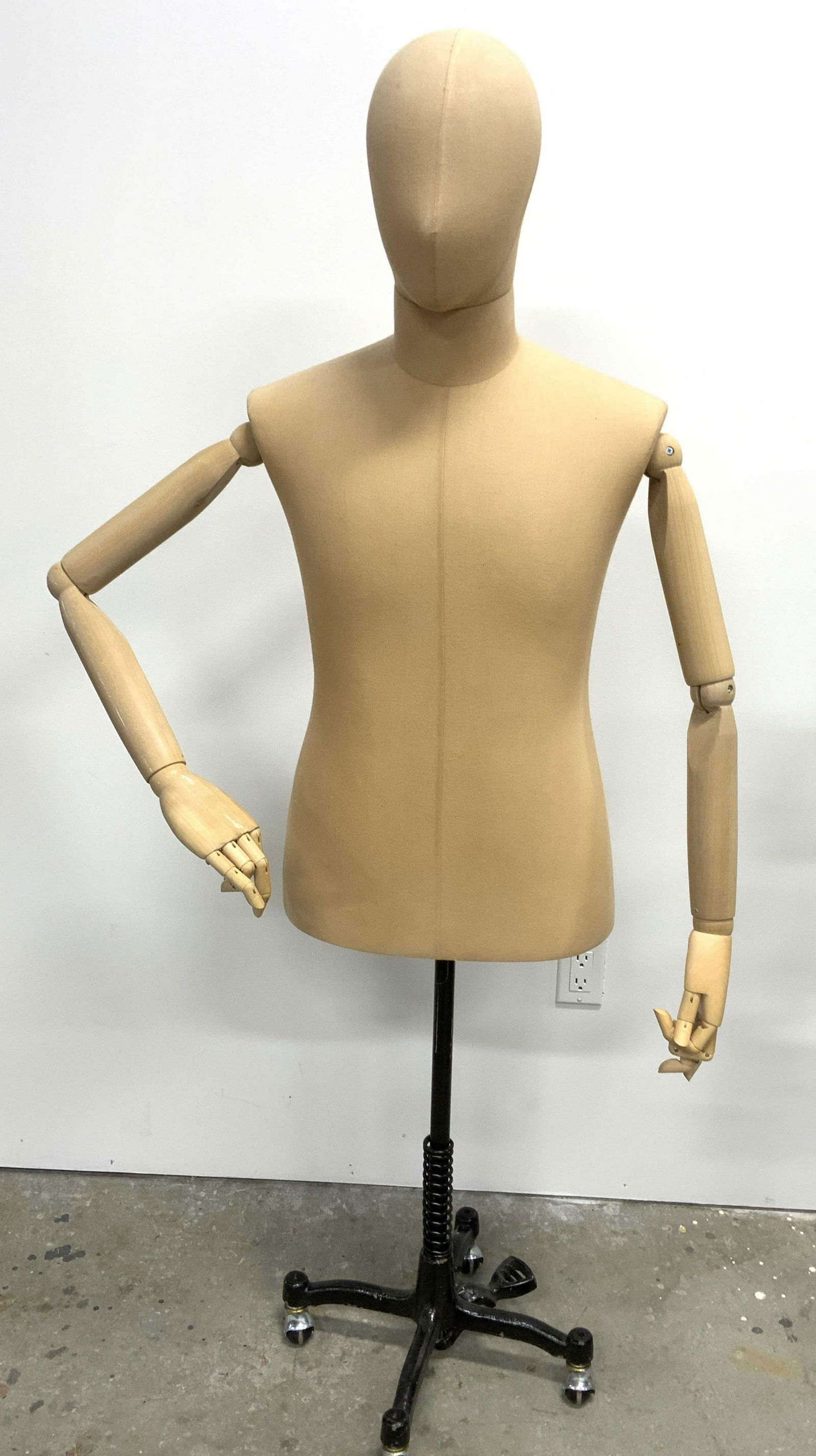 Articulated Mannequin w Cast Iron Base: Articulated mannequin. Base is crafted from iron and sits on 4 wheels. Arms and hands are articulated and pose-able , right arms shoulder cannot support the weight of its arm in all poses. Current hei