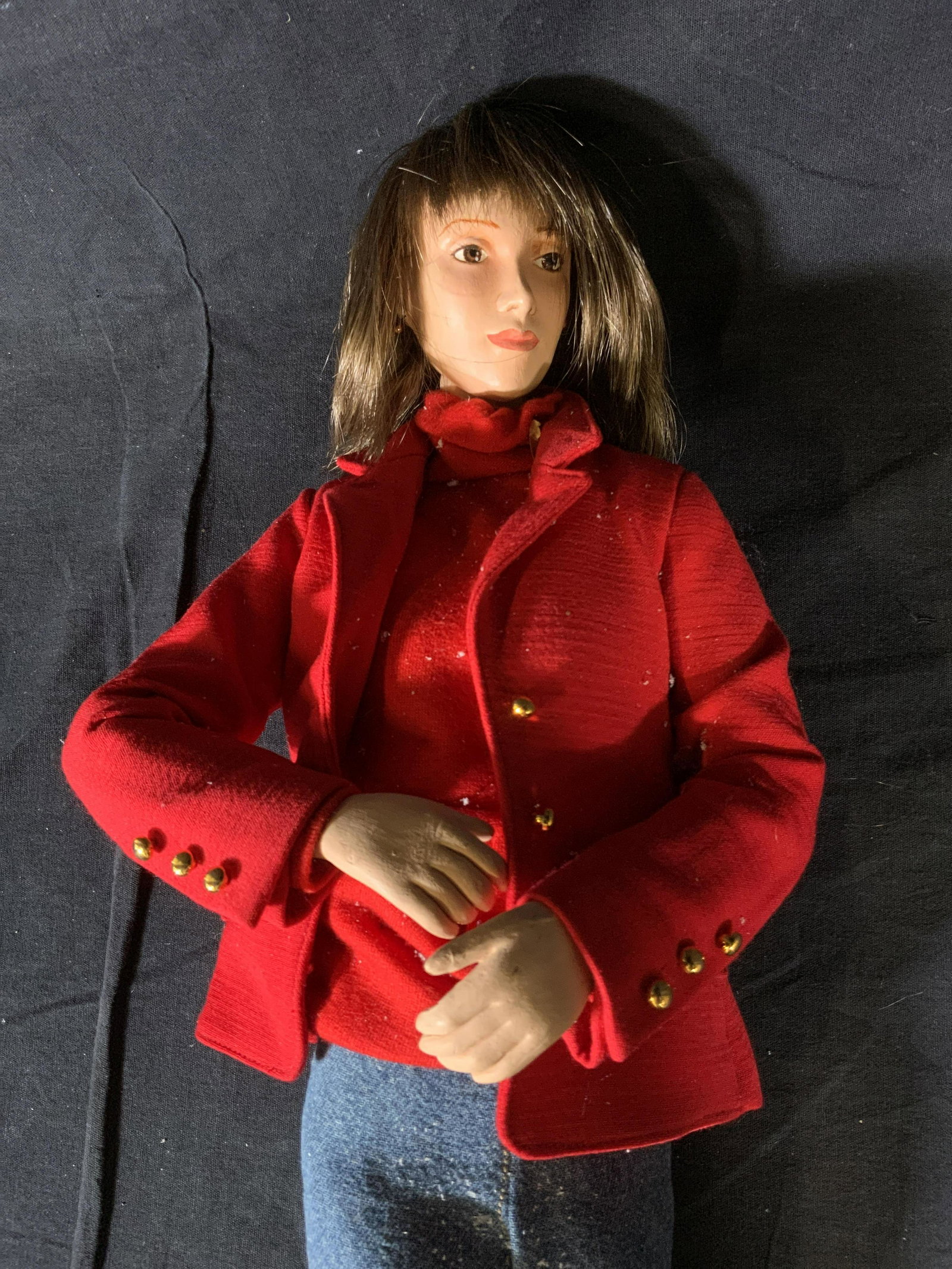 LORD & TAYLOR Window Display Puppet: LORD & TAYLOR Window Display Puppet, inscription to bottom of puppet’s foot reads ‘rod x’, a woman in a red jacket and jeans, measures 24 1/2 x 7 1/2 inches at widest point, some surface wear to