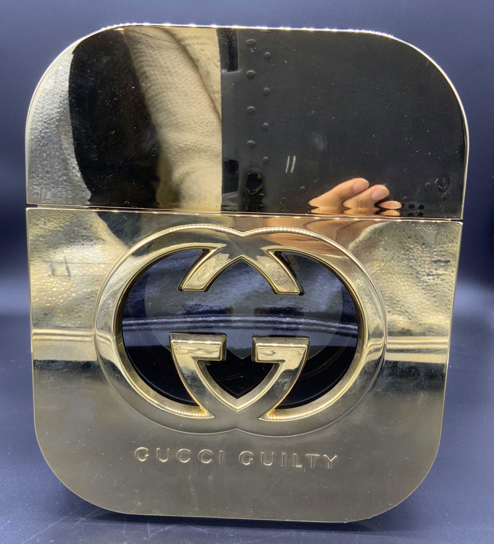 GUCCI Guilty Salesman’s Sample Perfume Bottle: GUCCI Guilty Salesman’s Sample Perfume Bottle, inscription to oversized bottle reads ‘Gucci Guilty’, measures 8 7/8 inches tall x 7 1/2 inches at widest point, some surface wear to bottle, perfu