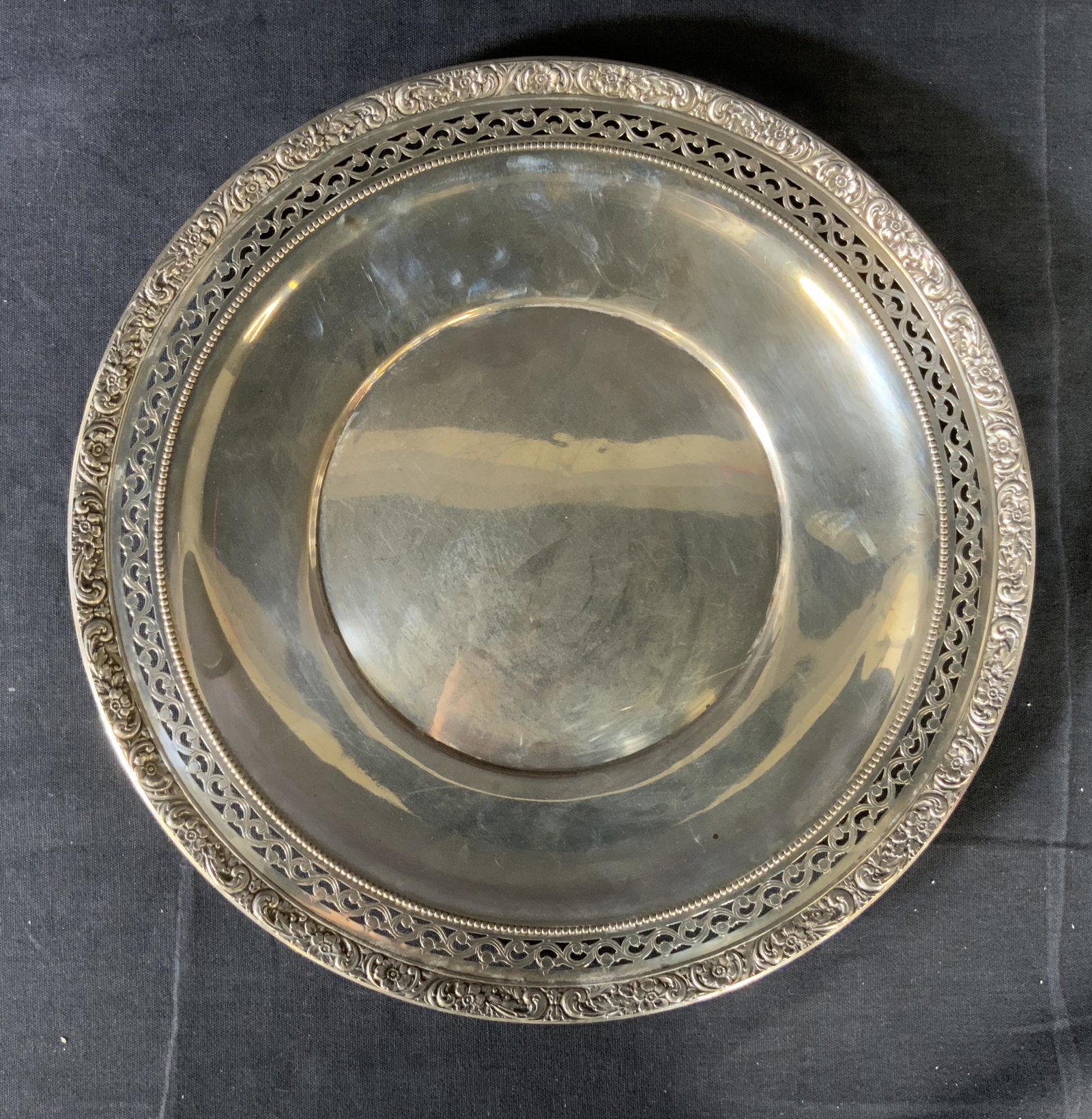Vintage Marked Sterling Silver Plate: Vintage Marked Sterling Silver Plate, inscription reads ‘Sterling Silver L81’, mark features crown, w, and lion, possibly Watson Co, measures 10 inches in diameter, weight: 8,20 ozt, some surface 